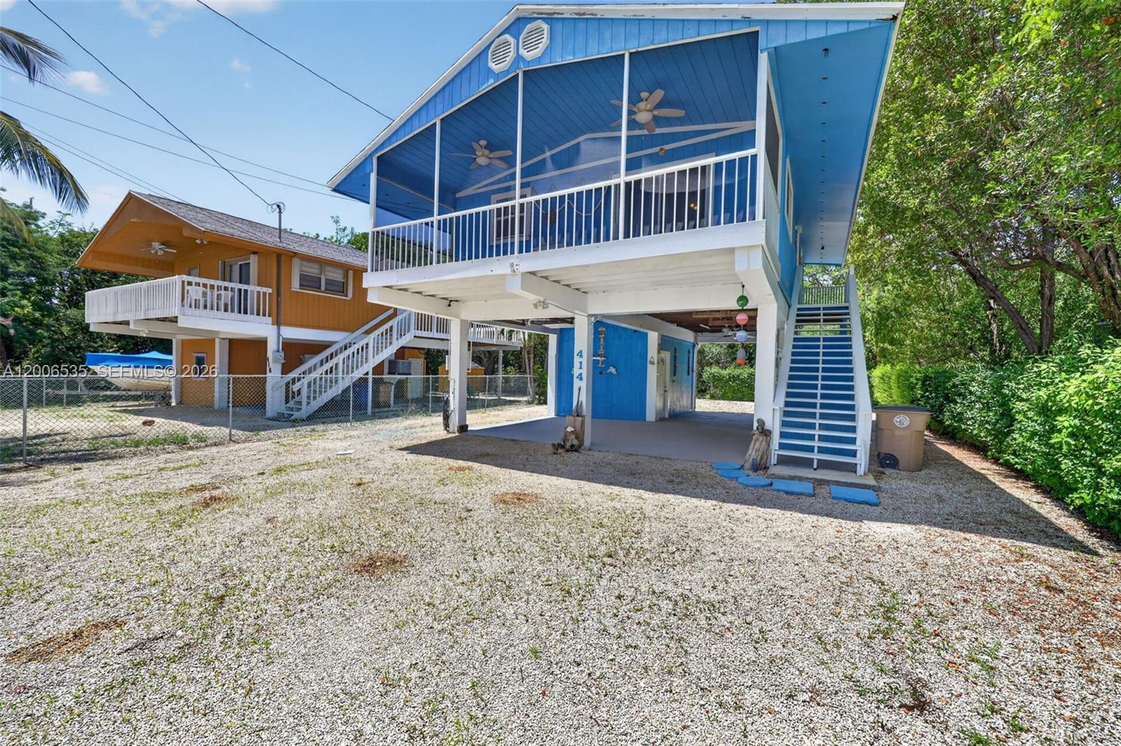 Welcome to beautiful Key Largo. This home in the desirable Bay Haven community offers the perfect blend of comfort, flexibility, and island living. Ideally situated near local dining, shopping, State Parks, you’ll enjoy easy access to boating, fishing, diving, and all the Keys have to offer. The home features 3 bedrooms and 2 bathrooms. One bedroom and bathroom is on the ground level, ideal for guests, extended family, or added privacy. Upstairs, you’ll find two additional bedrooms and full bathroom, along with the main living space and welcoming balcony—perfect for enjoying your morning coffee or relaxing in the evening breeze. The property includes generous parking for vehicles, boats, trailers, and other recreational equipment. Outdoor spaces include a spacious backyard with outdoor shower and offering plenty of room for entertaining, storage, or enjoying the tropical surroundings. Residents of Bay Haven enjoy access to a private, gated homeowners park featuring a boat ramp and sandy beach. Annual dues for 2026 is $550 and include one parking permit and key fob entry access. This property may be eligible for a special vacation rental license allowing short-term rentals of fewer than 28 days. Buyers are encouraged to independently verify all zoning, licensing, and permitted uses with Monroe County. Well cared for this Key Largo retreat is ready to enjoy as a full-time residence, vacation getaway, or investment opportunity.