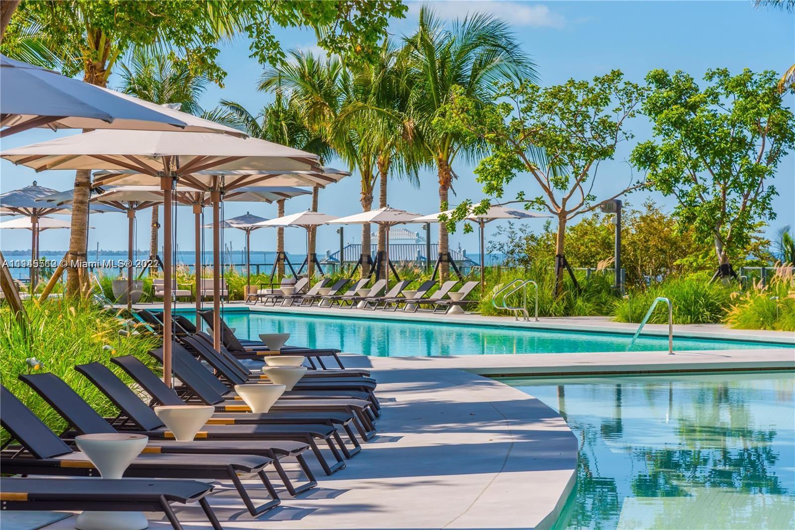 Live the ultimate lifestyle at the Club Residences at Park Grove. Designed by famed architect Rem Koolhaas, this fabulous seaside enclave is located at one of Coconut Grove’s most desired addresses. All the beauty of Biscayne Bay and the charm of Coconut Grove is at your fingertips. This stunning Penthouse unit was expanded to 4 bedrooms, providing a perfect floorplan for fine living. High level finishes are evident throughout. Park Grove proudly offers 5 acres of stunning gardens and world class amenities including a private screening room, a wine tasting room with private storage availability, a whole-body fitness center, a signature spa, and a rooftop pool with a deck that offers one of Miami’s most impressive views. A Very Special Home.