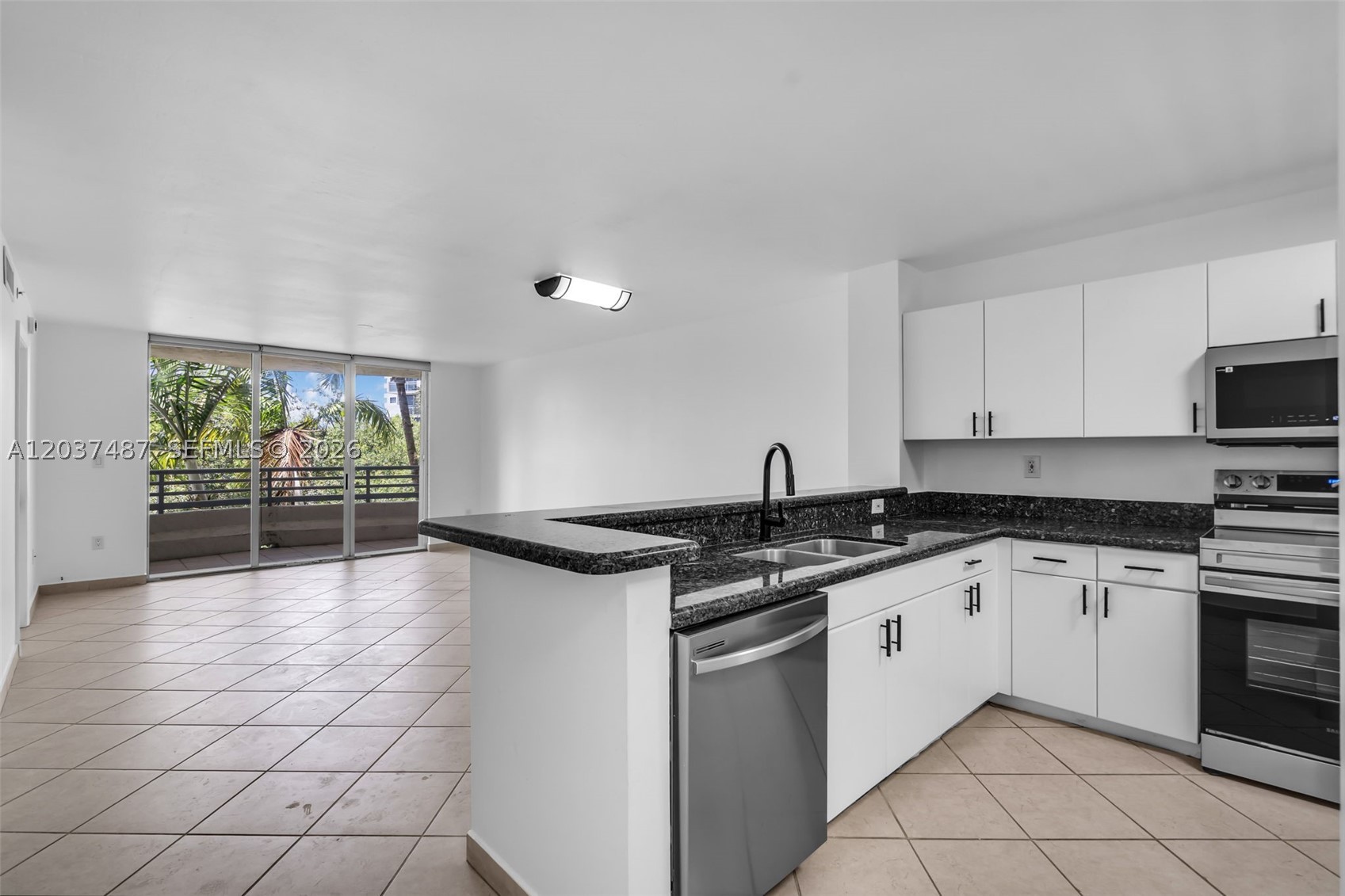 Welcome to this light-filled 2BD/2BA residence in the heart of Miami Beach, offering an open-concept layout with a spacious living and dining area, modern kitchen with stainless steel appliances, and a breakfast bar. Step onto the private balcony to enjoy lush palm views and serene surroundings. Both bedrooms are generously sized, including a primary suite with ample closet space and en-suite bath. The building offers a pool, parking, and a prime location just moments from Sunset Harbour, Lincoln Road, beaches, dining, and shopping. A perfect full-time residence, second home, or investment opportunity in one of Miami Beach’s most desirable neighborhoods.