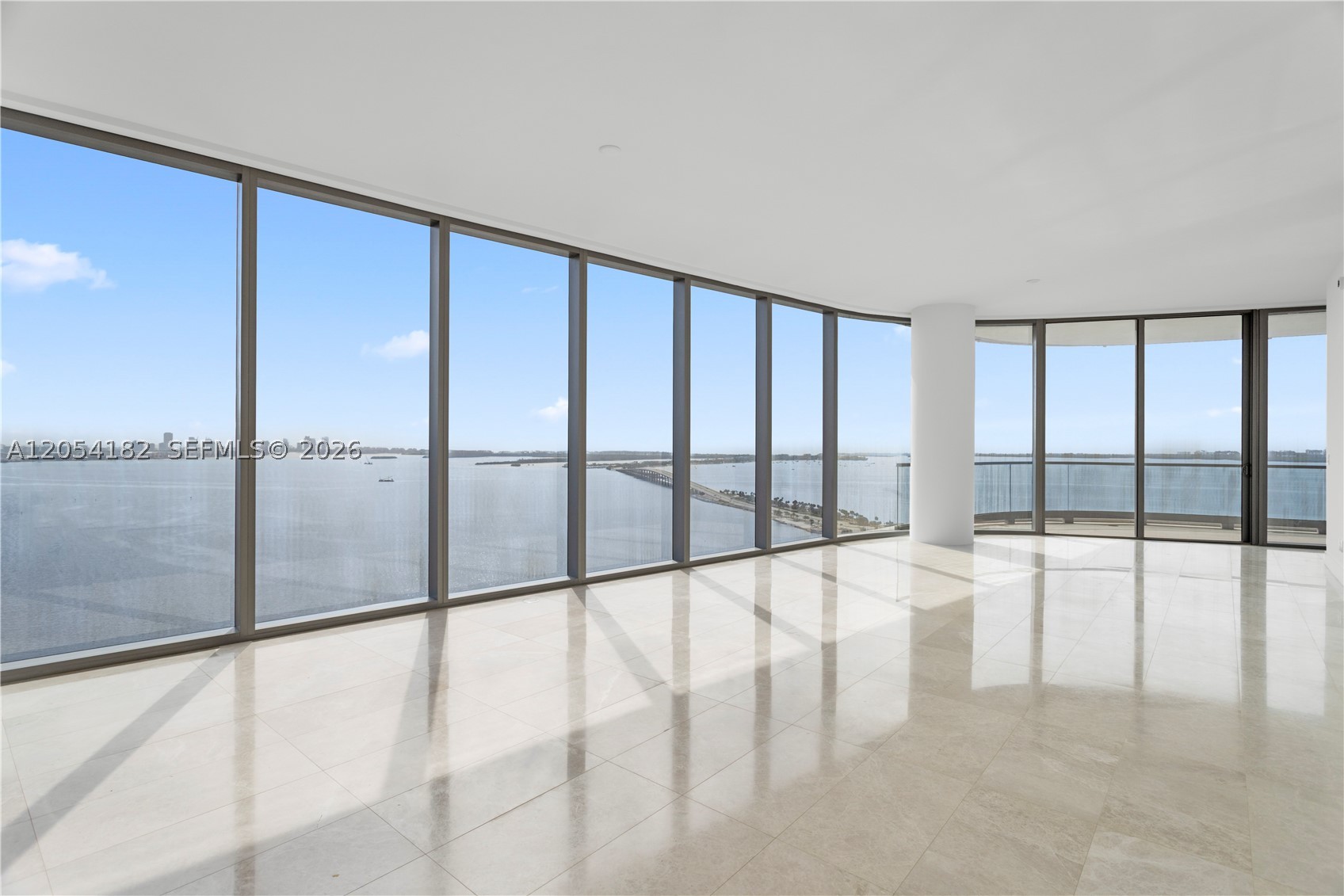This exceptional corner residence offers 4 bedrooms, 4.5 baths, 2,743 SF of interior living space, and a 483 SF private terrace with stunning Biscayne Bay and Miami skyline views. Private elevator entry, 10'8" ceilings, floor-to-ceiling impact glass, an open-concept layout, Gaggenau appliances, a spacious primary suite with spa-inspired baths, and a dedicated laundry room complete this elegant home.
Designed by Adrian Smith + Gordon Gill, Una features world-class amenities including bayfront and lap pools, full-service spa, state-of-the-art fitness center, owners' lounge, theater, children's playroom, 24-hour concierge, valet. Una residents are granted exclusive access to Grand Bay Beach Club conveniently located in Key Biscayne. Una Ideally located minutes from Brickell, Coconut Grove, Downtown Miami, Key Biscayne, and Miami International Airport.
