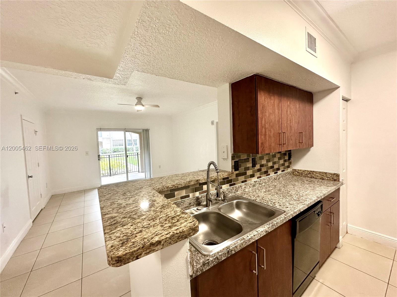 Enjoy serene garden views from the spacious patio of this 2-bedroom, 2-bath condo in the gated community of The Marquesa, Pembroke Pines. This first-floor bright and generously sized unit features tile flooring throughout the kitchen and the living room, and laminate floors in the bedrooms; an open kitchen with stainless steel appliances and granite countertops, and in-unit washer and dryer.  Both bedrooms have a large walk-in closet, providing ample storage. The unit includes one assigned parking, and 1 additional space in the guest parking. Pet-friendly community allowing rentals during the first year of ownership and requires a minimum 700 credit score for the primary applicant. Residents enjoy resort-style amenities including a swimming pool, fitness center, clubhouse, movie theater, playground, picnic area, and security.  Ideally located near Pembroke Lakes Mall, The Shops at Pembroke Gardens, Memorial Hospital, major highways, parks, and top-rated schools. Association approval typically completed within two weeks.