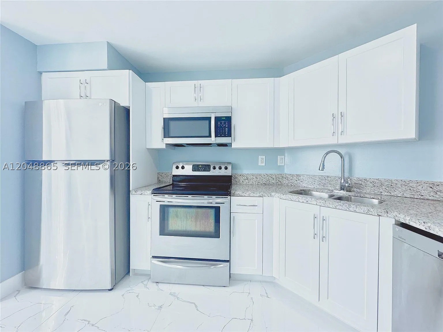 Great and newly renovated 2-bedroom, 2.5-bathroom townhome in Blossoms at The Hammocks! Enjoy modern living with  36x36 porcelain tiles, freshly painted walls, and new kitchen and bathroom vanities. This turnkey-ready home features spacious bedroom suites with walk-in closets and balconies, plus convenient assignment parking. Close to shopping plazas, restaurants, and entertainment options blocks away, this townhome offers the perfect blend of style, comfort, and convenience. Schedule a viewing today before it's gone!