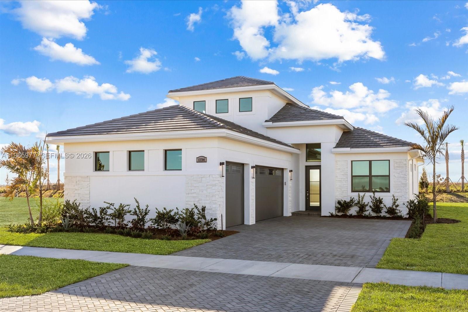 Move-in ready new construction, this Kolter Homes Leslie model is located in Tradition's Astor Creek, one of the most desirable communities in Port St. Lucie. This is one of few homes set on a private lot, offering tremendous savings with full access to resort-style amenities and the 18-hole championship course. Highlights include: soaring 11'4" ceilings, dramatic 16'W x 10'H sliding glass doors, gourmet kitchen, and bright second floor room with full bath, ideal for a media room, office, or guest space. The luxurious owner's suite features a spa-like bath and generous closet space. Upgrades throughout, including a 3 car garage. Astor Creek features a brand-new clubhouse, on-site bar and restaurant, and is the only new construction golf course community in the area.