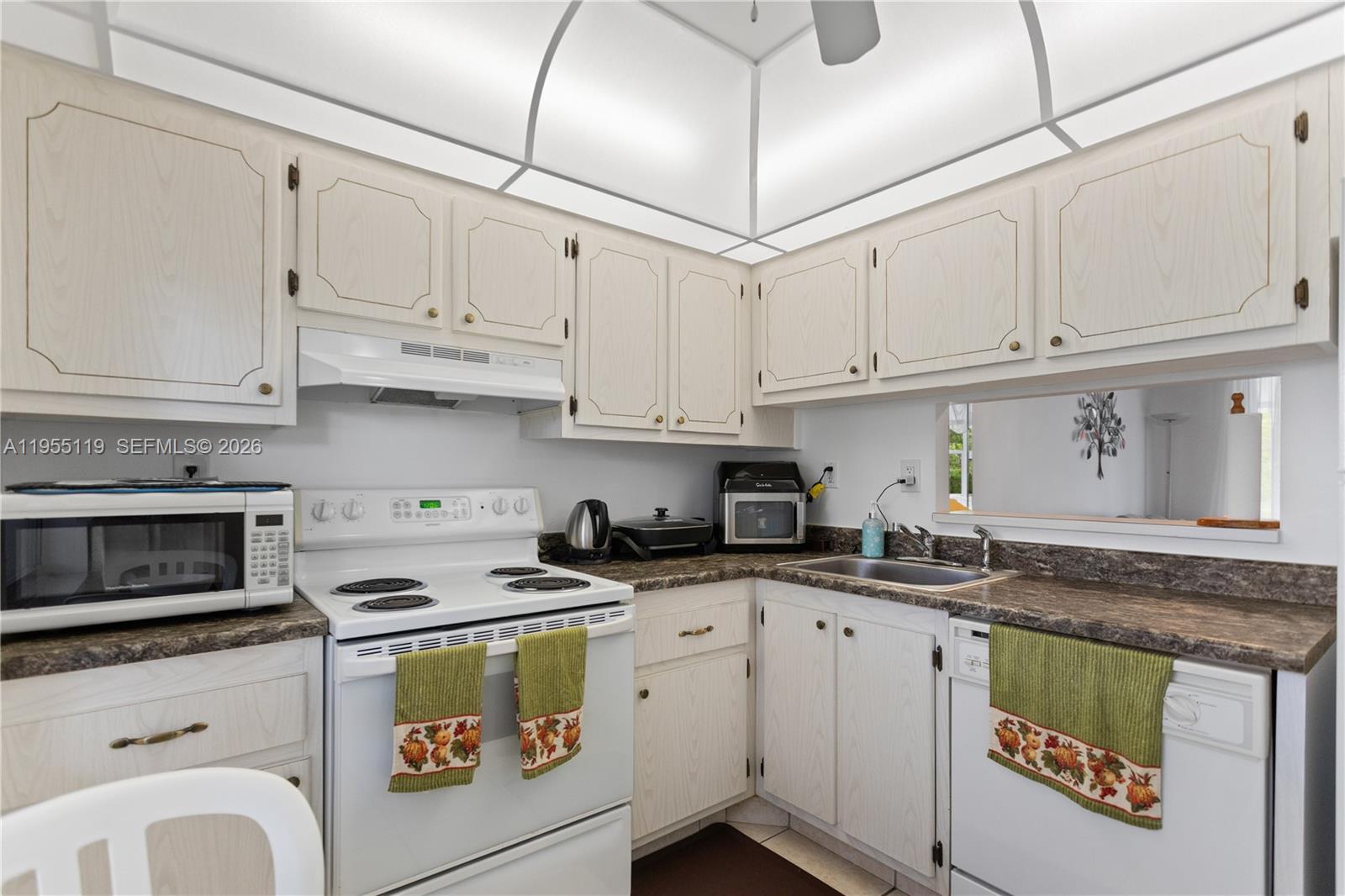 **Move right in this spacious 1 bedroom overlooking a southern side garden and pool area**  Sold completely furnished including some newly installed doors and windows, a/c always serviced and running like new, new electric box and up to new city codes, tankless water heather and more...**  Priced right for fast sale. Dont miss...