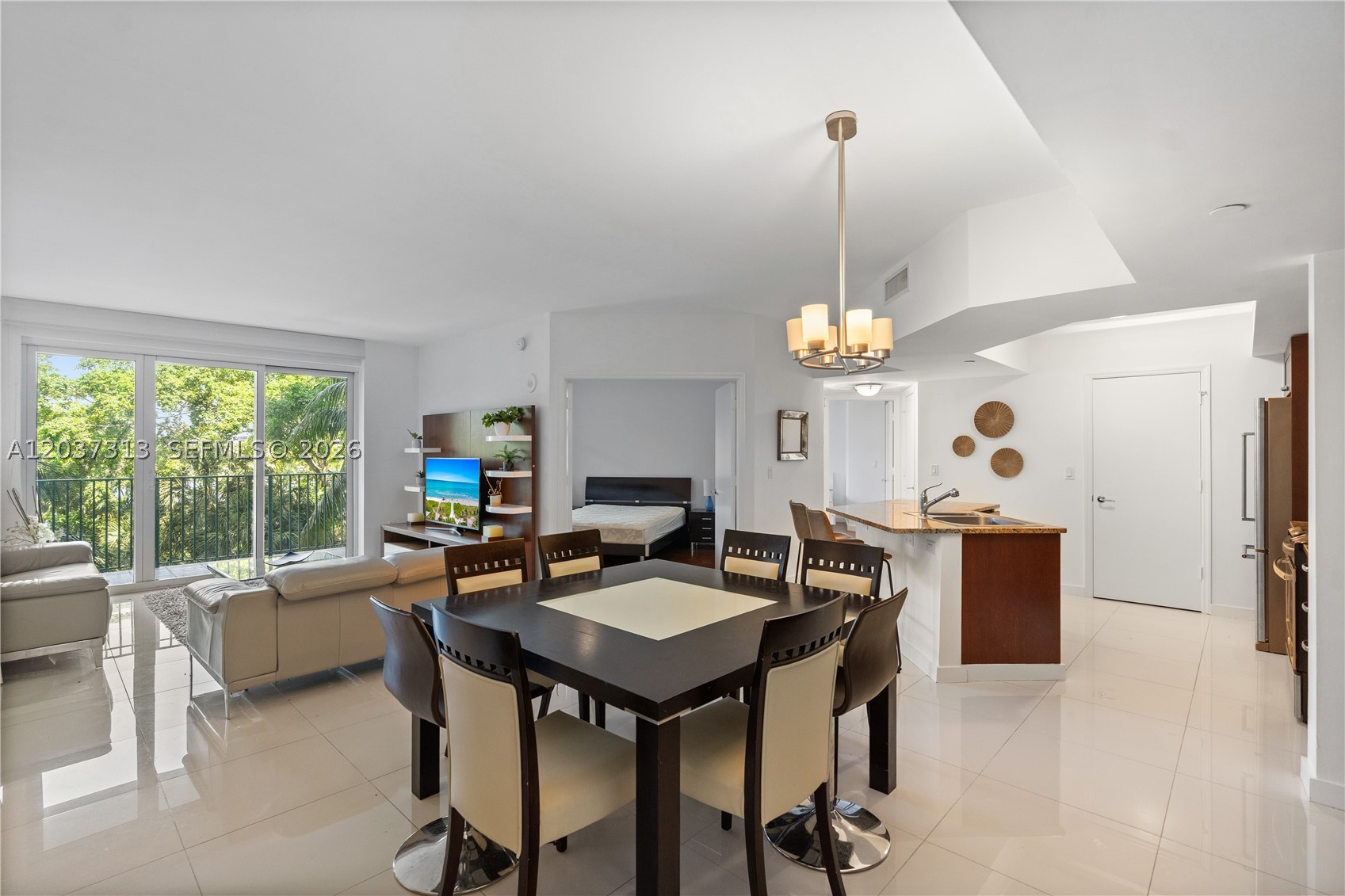 Beautiful and spacious condo located at Turnberry Village in Aventura. The property sits adjacent to the world-renowned Turnberry golf course. This freshly painted third floor condo boasts three beds and three full baths with porcelain and wood flooring throughout. It offers a nice view of the property greenery and just a bit of the lake at the golf course from an expansive balcony. The open European style kitchen has Kitchen Aid appliances and additional built in kitchen cabinetry. Additionally, the bedrooms offer custom made walk-in closets and blackout shades. The floor to ceiling windows and sliding doors are high-impact rated to withstand those S. Florida storms. First class amenities include heated pool, fitness center, spa, massage room, 24hr concierge, security and more.