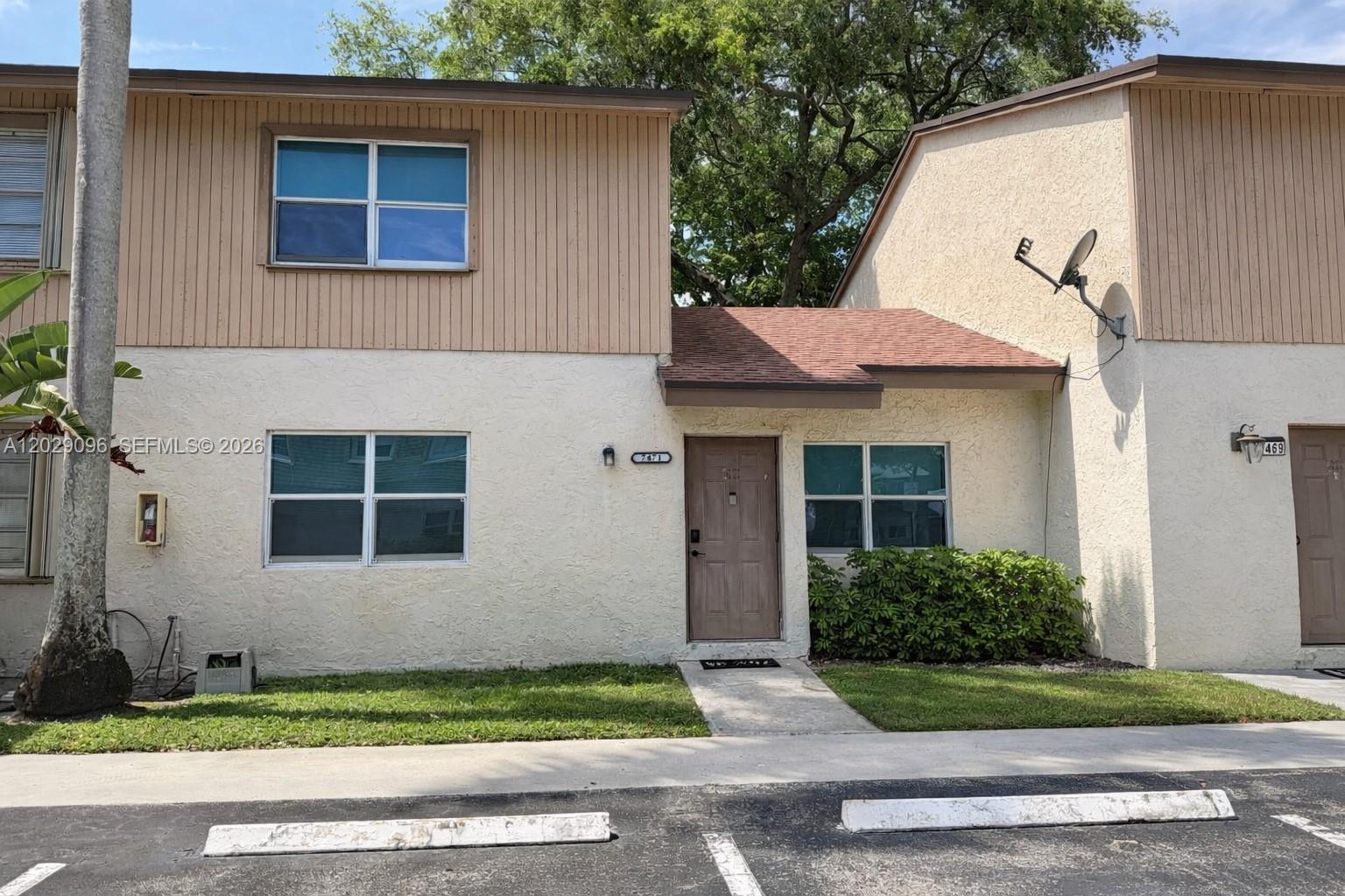 Welcome to this beautifully maintained 3-bedroom, 2-bathroom townhome located in the desirable Apple Creek community. This inviting home features a bright and open floor plan with updated flooring throughout and a stylishly renovated kitchen perfect for cooking and entertaining. Enjoy the convenience of a full-size washer and dryer, impact windows for added peace of mind, and two assigned parking spaces. All kitchen appliances are included, making this home truly move-in ready. Whether you're a first-time homebuyer or simply looking for a comfortable and well-maintained home, this charming townhome offers convenience, style, and great value in a wonderful community.  No condo association minimum credit score and no required down payment. Motivated seller-bring all offers!
