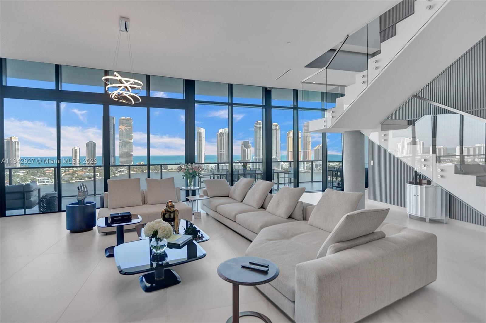 Experience luxury living at its finest in this stunning two-story fully furnished penthouse in Prive Island. This 4 bed, 5.5 bath Penthouse with a 2,595 sq/ft terrace features stunning views of the ocean and Intracoastal, two summer kitchens, an its own outdoor swimming pool, 15 ft ceilings. The open floor plan features a European-style kitchen with Miele appliances, upgraded Toto toilets, frameless doors throughout, and smart shades. Furnishings by Italian designers such as Minotti, B&B Italia, Addison House, Anima Domus, and outdoors by Royal Botania. Get pampered by a 5-star service, including concierge, private beach, 24 hour security, 20,000 sq/ft of spa and gym, two swimming pools, wine cellars, social rooms, tennis court, valet parking, and full-service marina for yachts up to 150’.