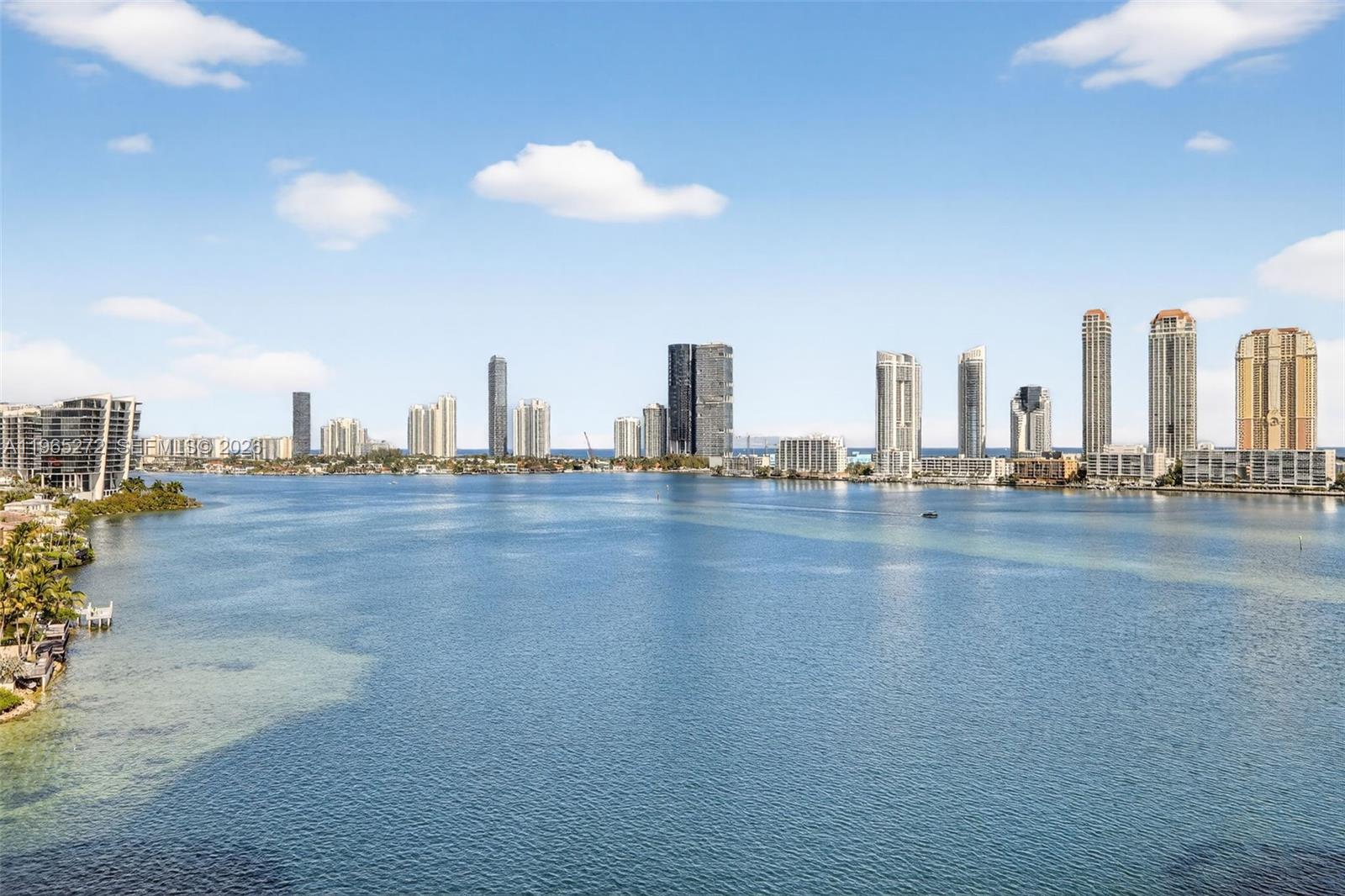 SPECTACULAR VIEWS TO THE INTRACOASTAL AND OCEAN FROM THIS BRIGHT AND SPACIOUS HOME IN THE BEAUTIFUL 3000 BLDG AT WILLIAMS ISLAND. SPECIAL FEATURES INCLUDE ACCESS TO THE WRAP-AROUND BALCONY FROM EVERY ROOM, MARBLE FLOORS IN LIVING AREA, GRANITE COUNTERS & BACKSPLASH IN THE KITCHEN, HURRICANE SHUTTERS, WALK-IN CLOSETS IN BOTH BEDROOMS. ENJOY THE NEWLY RENOVATED POOL AREA WITH CABANA COVERED LOUNGE AREAS, HOT TUB, SUMMER KITCHEN/ BBQ AREA. BUILDING IS PET FRIENDLY UP TO 25 LBS. LIVE IN PRESTIGIOUS WILLIAMS ISLAND WITH FULL AMENITIES: 24 HR SECURITY & VALET, COMMUNITY POOLS, 27,000 sq ft GYM AND SPA, 14 TENNIS COURTS, 4 PICKLEBALL COURTS, 2 PADEL COURTS, HAIR SALON, MARINA, 4 RESTAURANTS, KIDS PLAYGROUND, BASKETBALL COURT, DOGGIE PARK, COMPLIMENTARY SHUTTLE SERVICE, HI TECH SECURITY, WALKING/RUNNING TRAIL, CONCIERGE, WALK TO SHOPS & RESTAURANTS AND CLOSE TO AVENTURA MALL, A+ SCHOOLS.