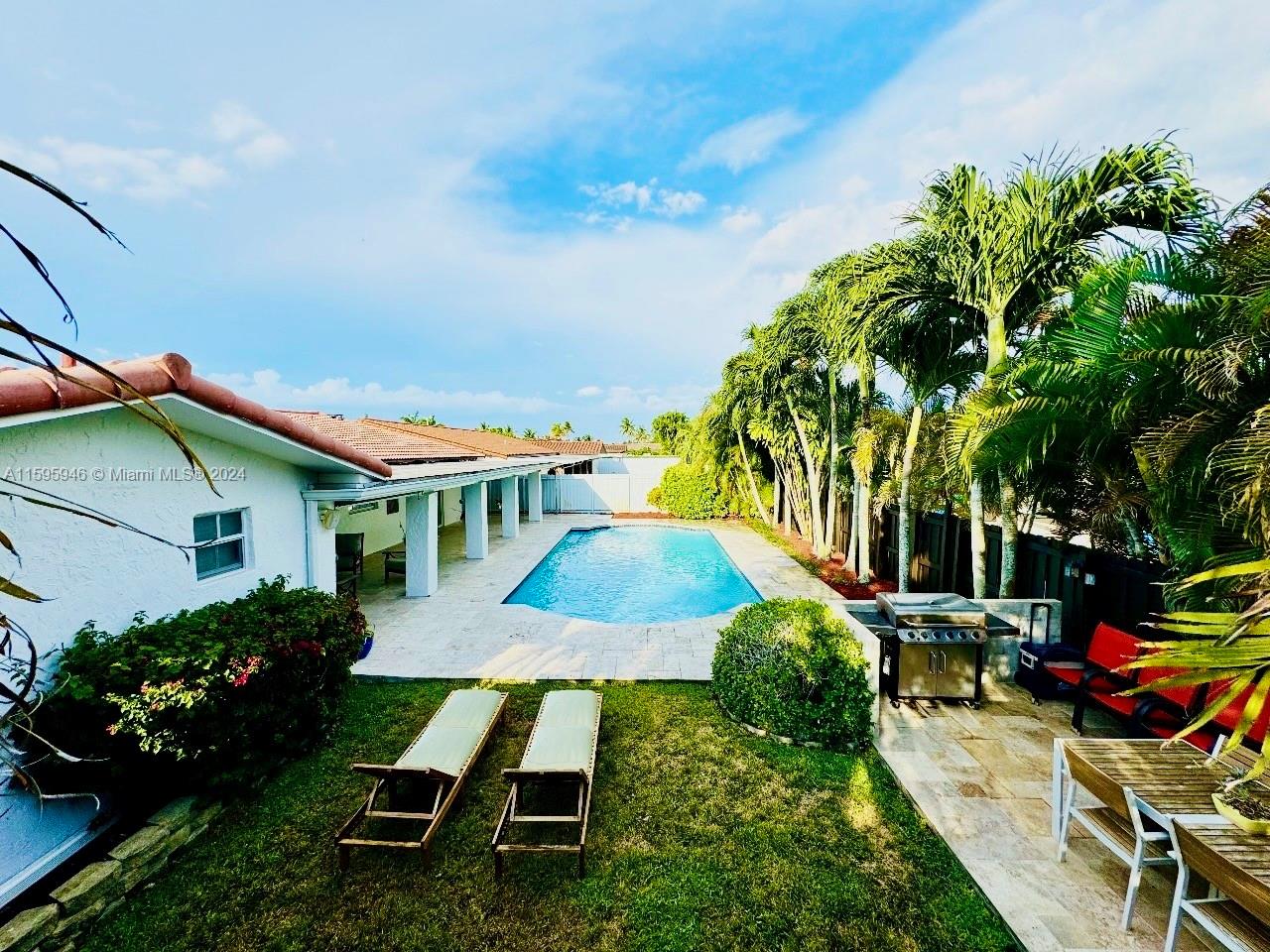 This extraordinary property is located next to Tamiami Lakes Park and Joe Hall Elementary, an A-rated public school. Great location! It is a fully renovated 4-bed, 3-bath (including poolside shower, sink, and toilet), one-car garage, and saltwater pool home. New floor, roof, impact windows, A/C, electric panel, baths, kitchen, high-end appliances, Italian porcelain tile, electric car charger, etc. Large kitchen with granite breakfast island opens to the family room which is filled with natural light. Enjoy your fully fenced private backyard, large covered patio, grill area & plenty of lounging space. This is a rare opportunity for luxury living in one of Miami’s most coveted neighborhoods. Don’t miss out! Easy to show and priced to sell.
