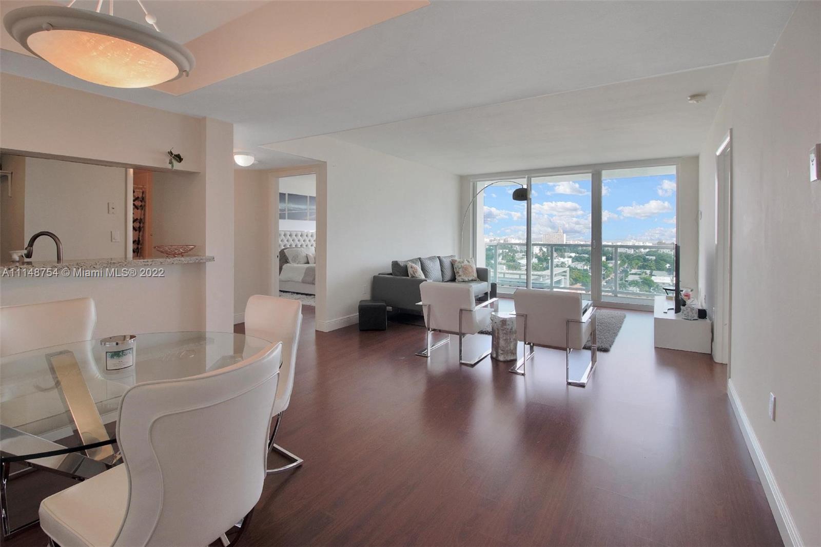 Tastefully furnished 2 bedroom, 2 bathroom condo overlooking the new park.  Split floor plan with large bedrooms and walk in closets.  Wood flooring throughout.  Full service building with wonderful amenities-- two pools, tennis/basketball court, fitness center.  Prime location.
