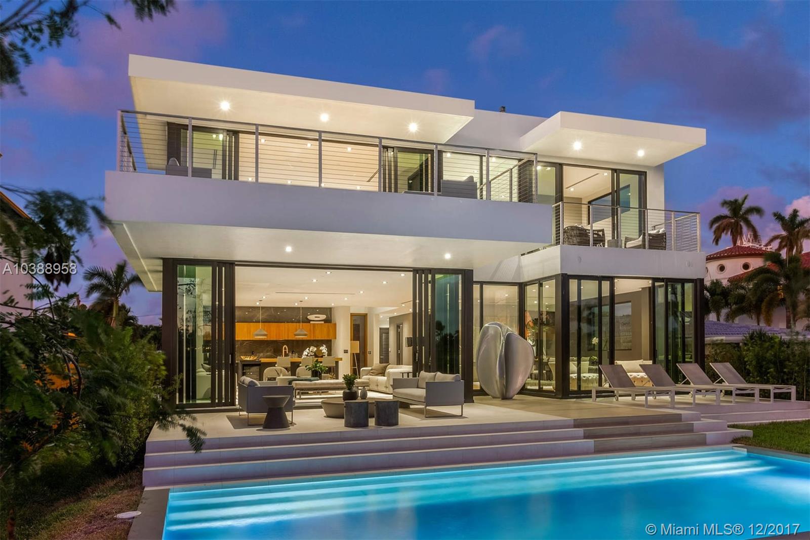 Located on a quiet street with direct access to the prestigious La Gorce Country Club, this expansive 5 bed, 5.5 bath new construction home delivers true luxury living. The home is staged by Artefacto throughout the 5,126 interior SqFt and sitting on a 9,632 SqFt lot. Upon entry, you are greeted by sweeping golf course views, floor to ceiling impact windows and fully retractable doors flooding the home with natural light. Entertaining & dining are completely seamless with an open chef's kitchen featuring Miele appliances. The master bedroom offers endless golf views from a private terrace, walk-in closet and spa-like bathroom. Additional features of this home include an infinity pool, roof-top terrace, two-car garage, large terraces throughout and some of the most spectacular sunset views.
