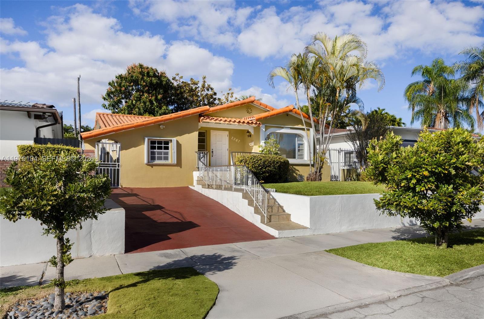 Located in the heart of Silver Bluff, this property presents a compelling chance to reimagine a home in one of Miami’s most central and connected neighborhoods. Elevated and gated, the home features 4 bedrooms and 2 bathrooms, including a 3/1 main residence and a converted 1/1 with its own private side entrance, ideal for guests, a home office, or flexible use. Natural light fills the interiors, highlighting the decorative fireplace and French doors that lead to a Florida room overlooking the patio framed by mature landscaping. The existing layout and generous footprint create an exceptional canvas for those looking to tailor the home to their vision. Just minutes from Coconut Grove, Coral Gables, Brickell, Downtown Miami, and Miami International Airport, with convenient access to major highways, this address offers lasting value in sought-after Silver Bluff.