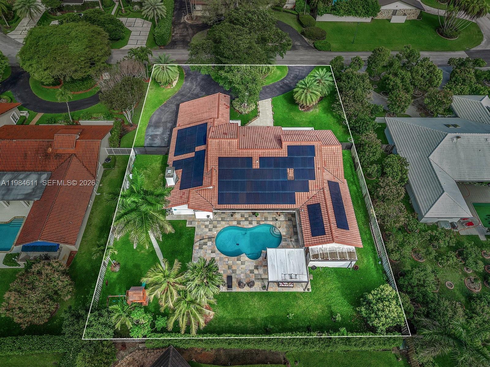 Ideally located in the sought-after community of Galloway Glen Estates, this beautifully renovated residence sits on a lush 21,875 SF cul-de-sac lot, just moments from The Falls and Dadeland Mall. Offering 5,235 total SF, the home features 6 bedrooms and 4 bathrooms, with community benefits that include 24-hour security patrol. A circular driveway and marble entry path lead to a welcoming façade framed by tropical landscaping. Outdoor living is exceptional, featuring an expansive covered terrace with wood beam ceilings, marble pool deck, heated saltwater pool with mosaic tile finish, gazebo, and a fully equipped summer kitchen—ideal for entertaining. Inside, vaulted wood-paneled ceiling and refined finishes create an inviting atmosphere. The home offers spacious living and dining areas, a family room with fireplace, and a custom wet bar. The modern kitchen showcases quartz countertops, a large island, premium KitchenAid appliances, and abundant storage. The private primary suite features two walk-in closets and a marble bath with dual vanities and a frameless glass shower. Additional highlights include impact windows and doors, solar panels for energy efficiency, and a comprehensive 2021 renovation—delivering comfort, style, and convenience in a prime location.