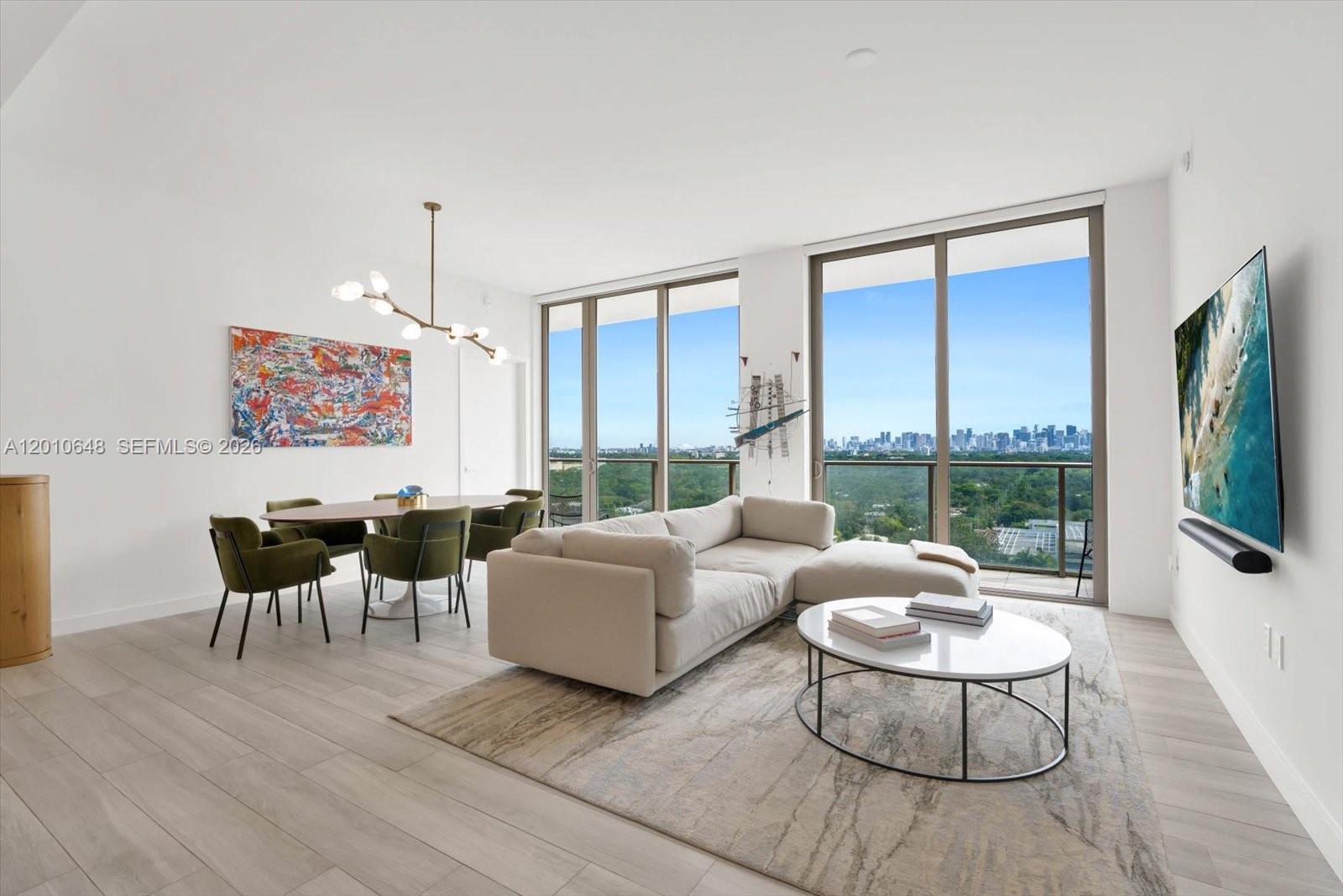 Discover refined waterfront living at Mr. C’s in the heart of Coconut Grove, in this impeccably designed 2-bedroom, 2.5-bath residence spanning 1,505 SF. Thoughtfully laid out with an exceptional split-bedroom floor plan, the residence maximizes space, privacy, and flow. Floor-to-ceiling glass opens to a spacious private balcony with captivating skyline, city, and water views, seamlessly connecting indoor and outdoor living from both bedrooms. Interiors are elevated by 10-foot ceilings, wood-look tile flooring, recessed lighting, and automated blinds, creating a sophisticated yet inviting ambiance. The chef’s kitchen is a true centerpiece, featuring a striking waterfall island with terrazzo countertops, Italkraft cabinetry, and a full suite of Sub-Zero and Wolf appliances. The primary suite offers a serene retreat with a walk-in closet and spa-inspired bath complete with dual vanities, quartz surfaces, custom cabinetry, and a frameless glass shower with built-in bench. Additional highlights include an in-unit washer/dryer and two valet parking spaces with guest privileges. Residents enjoy world-class amenities, including rooftop and resort-style pools, spa and fitness center, concierge and butler service, a children’s playroom, and curated dining such as La Specialità Cafe and Market. Where timeless design and effortless luxury define everyday living.