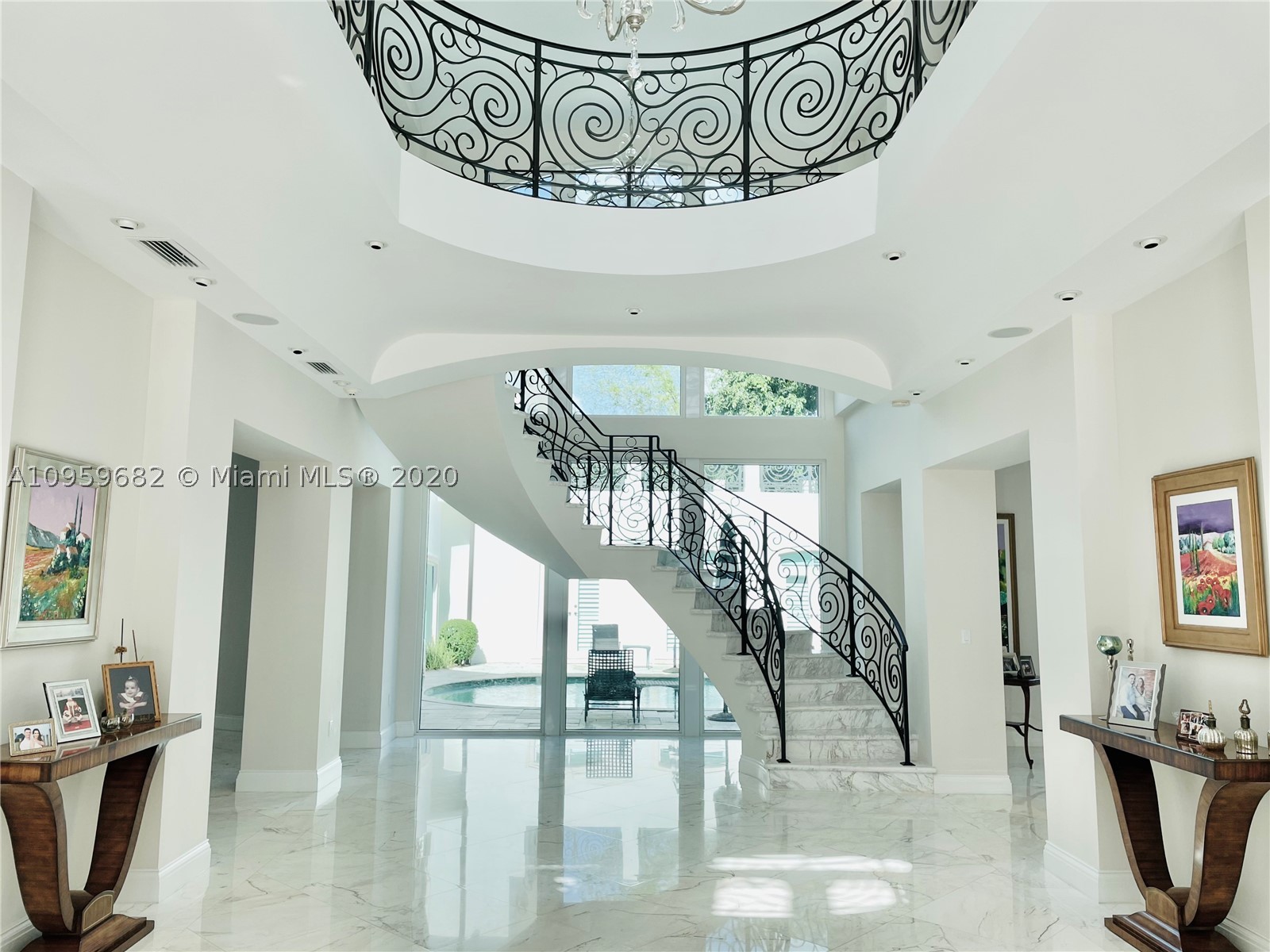 Sophisticated French Transitional masterpiece on a corner lot.This unique sanctuary features one of a kind style & leaves no detail spared.Upon entering 12ft ceilings & custom millwork are breathtaking.Principal suite is adorned with grand entrance,fireplace & extensive master spa bath.Home has 2 master suites & large balconies from every bedroom that flow right thru to the exquisite outdoor spaces.Solid wood professional chef kitchen fully equipped.Stunning dining w 900 bottle wineroom.Smart home w ample measures of security & fiber optic lighting thru-out.Full house Generator, Elevator, Theatre & Guest House.Ultra luxury living, wood & marble flooring throughout. This rare design was done with the highest quality finishes & professional landscaping. This gated gem is truly one of a kind.