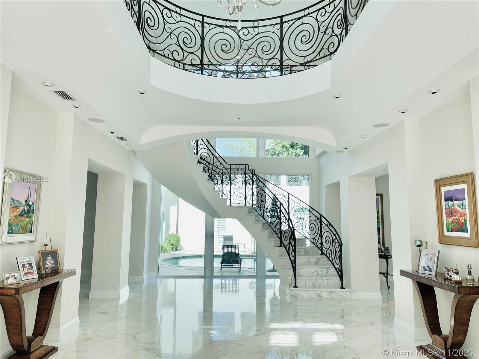 Sophisticated French Transitional masterpiece on a corner lot.This unique sanctuary features one of a kind style & leaves no detail spared.Upon entering 12ft ceilings & custom millwork are breathtaking.Principal suite is adorned with grand entrance,fireplace & extensive master spa bath.Home has 2 master suites & large balconies from every bedroom that flow right thru to the exquisite outdoor spaces.Solid wood professional chef kitchen fully equipped.Stunning dining w 900 bottle wineroom.Smart home w ample measures of security & fiber optic lighting thru-out.Full house Generator, Elevator, Theatre & Guest House.Ultra luxury living, wood & marble flooring throughout. This rare design was done with the highest quality finishes & professional landscaping. This gated gem is truly one of a kind.