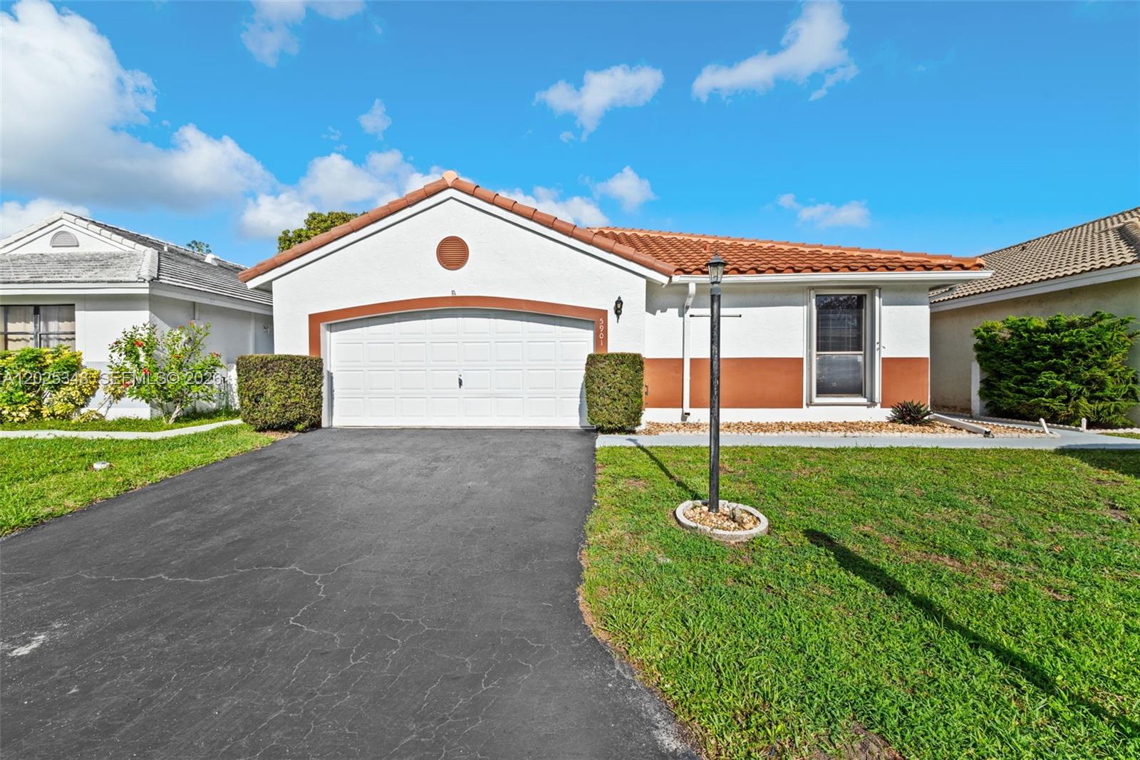 Terrific West Davie location with top-rated schools! Adorable & affordable 3-bedroom, 2-bath home with 2-car garage priced perfectly for today’s market. Updated kitchen & baths plus pretty laminate flooring throughout living areas & bedrooms. Third bedroom currently used as a den, office, or flex space. Useful covered patio with vinyl window enclosure adds extra living space perfect for relaxing or entertaining year-round. Fenced & walled backyard offers exceptional privacy & is perfect for pets. Roof only 2 years old! Accordion shutters provide peace of mind plus potential insurance discounts. Enjoy a short walk to the community pool or the fabulous park directly across the street. Beautiful tree-lined Ivanhoe entrance, low HOA, plus convenient access to shopping, dining, & major highways make this home an incredible value. Builder floor plan shows more SF than tax rolls, please verify square footage with appraiser.