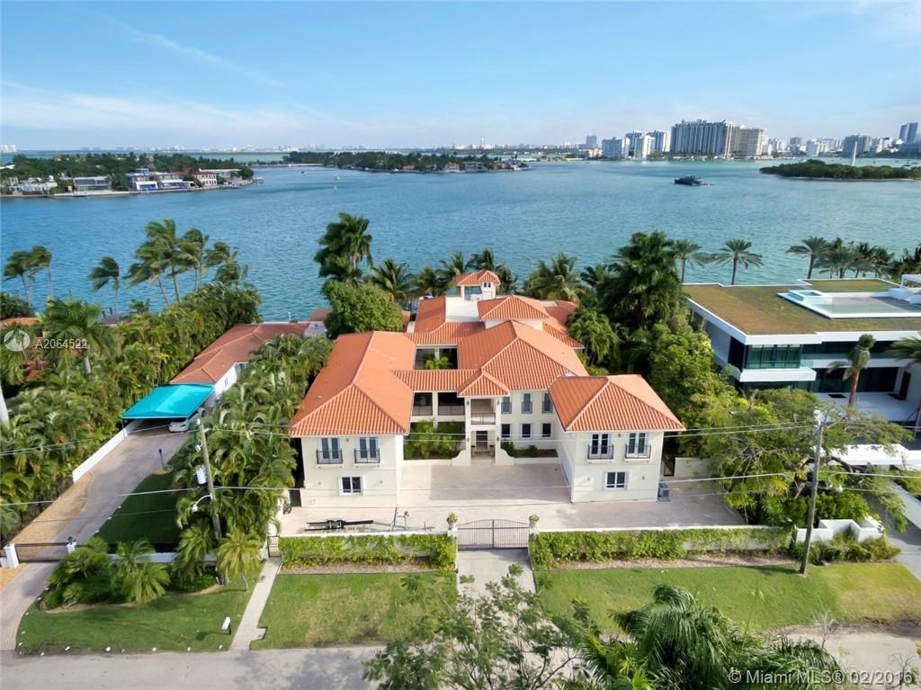 RARE OPPORTUNITY TO PURCHASE SPACIOUS BAYFRONT HOME IN ONE OF MIAMI'S MOST SOUGHT AFTER LOCATIONS. HUGE 2 STORY HOME WITH UNIQUE LAYOUT. 3 GUEST SUITES WITH FULL KITCHENS. DOUBLE LOT WITH 120' ON THE WIDE BAY. BOAT DOCK 53'X14' + BOAT LIFT. OVERSIZED POOL WITH FULL CABANA BATH & BAR-B-Q KITCHEN. 6 ZONE CENTRAL A/C. COVERED PATIOS ACCESSING ALL ROOMS. CENTRAL COURTYARD PROVIDES LOTS OF NATURAL LIGHT. TWO SEPARATE 2-CAR GARAGES. SPACIOUS 3RD LEVEL SUN DECK.