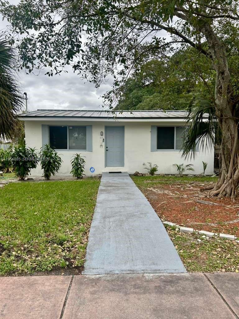 Cozy 2-bedroom, 1-bath single-family home in Fort Lauderdale with a new metal roof (50-year warranty), new AC, new electrical panel, new flooring, and updated bathroom. Features hurricane impact windows and a spacious backyard perfect for BBQs and gatherings. Excellent location—just 5 minutes from Flagler Village and 10 minutes from Las Olas, with easy access to I-95. Parking available for multiple vehicles. Lot size 5,004 sq ft.