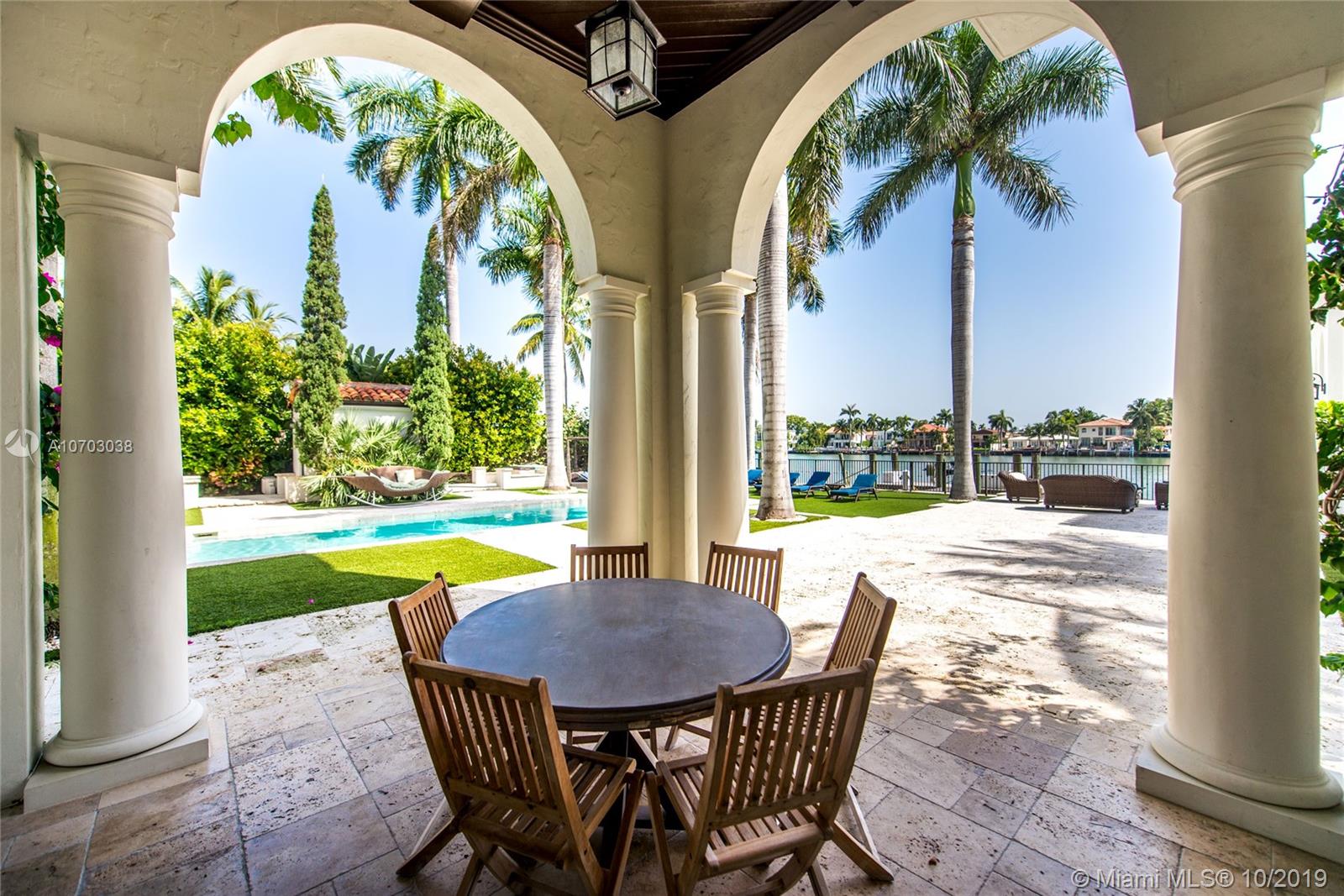 Exclusivity, fine design and bay breeze in Palm Island. Set on a spacious 30,000 SF lot and boasting 13,201 SF of living area, this 8 bedroom, 10/2 bathroom estate is the epitome of Miami Beach living. The Master Suite includes spacious his and hers bathrooms, his and hers closets and a private terrace overlooking the bay. Enjoy waterfront views from every room including the kitchen, family room and formal living room. Entertain indoors in the expansive formal dining room, outside in the central courtyard or by the bay and infinity pool. A private dock with 100 Feet of frontage completes this magnificent estate situated minutes from S Beach, Downtown & the Miami International Airport.