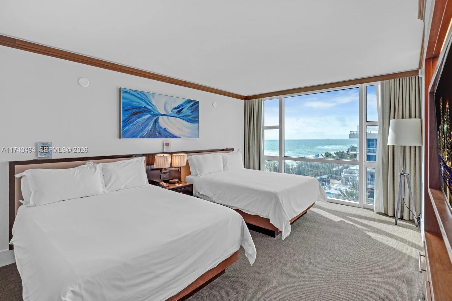 Experience direct, unobstructed ocean views from this high-floor 1-bedroom residence at Carillon Miami Wellness Resort, one of the top-ranked wellness resorts in the U.S. One of the few Miami Beach properties permitting true flexible short-term rentals (daily, weekly, or monthly), this fully turnkey suite generated $77,853 in gross revenue in 2025, with $52,246 already booked through July 2026. Unlike many competing units, it is positioned as a seamless, rental-ready asset from day one, complete with a designer furniture package, Miele cooktop and dishwasher, refrigerator, and European-style combo washer/dryer. Seller financing available for qualified buyers, a rare opportunity to acquire a cash-flowing oceanfront suite with flexible terms. Owners and guests enjoy access to the resort's 70,000 sq. ft. spa and fitness center, 4 pools, full beach service with chairs and attendants, 150+ weekly fitness classes across four studios, indoor rock climbing wall, and on-site restaurant and bar. Publix and Walgreens are directly across the street, with Bal Harbour, the Design District, Wynwood, South Beach, and Downtown Miami just minutes away. Optional hotel management provides a fully hands-off ownership experience ideal for international buyers seeking a turnkey U.S. asset. (Door 616)