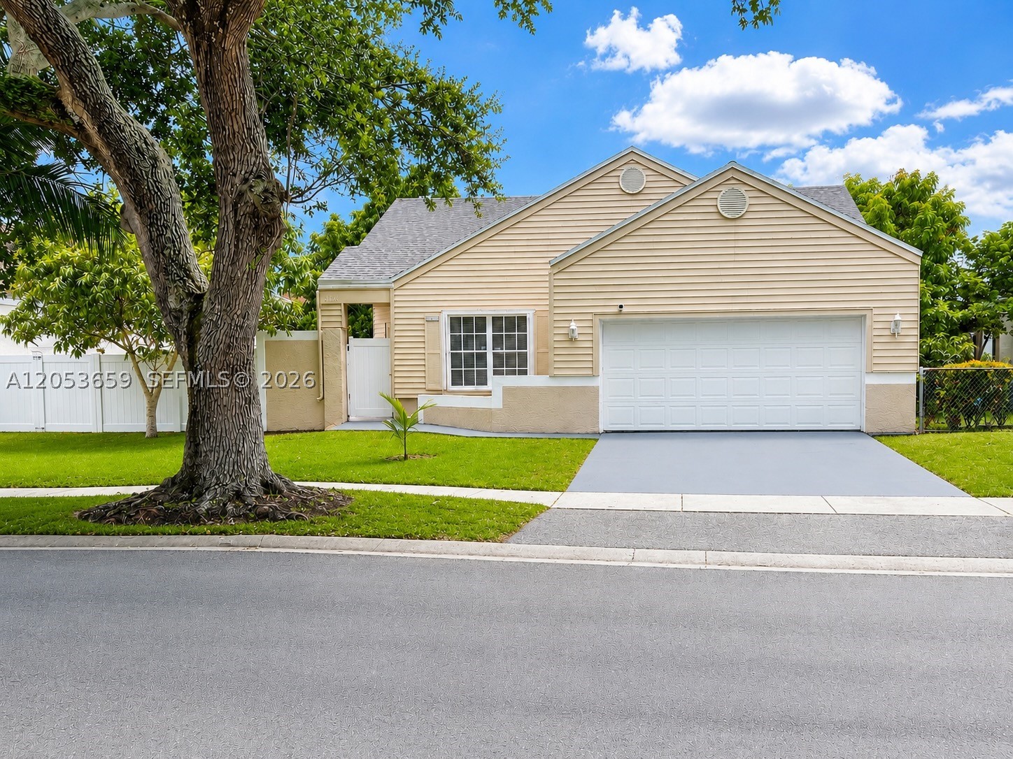 Welcome to this beautifully renovated 4-bedroom, 2-bath home nestled on a quiet cul-de-sac in the desirable Cinnamon Place community. Featuring an open floor plan with soaring volume ceilings, this move-in-ready home offers generously sized bedrooms, including a primary suite with a walk-in closet, while the secondary bedrooms provide ample closet space. Updated bathrooms and tile flooring throughout add to the home's appeal. The beautifully renovated kitchen is perfect for everyday living and entertaining. Enjoy peace of mind with a newer roof, hurricane impact windows, and accordion shutters for added storm protection. Step outside to a large screened patio and private side yard, creating the perfect setting for outdoor dining, entertaining, or simply relaxing. The community offers roving security, a sparkling pool, tennis courts, and low monthly HOA fees. Conveniently located near major highways, shopping, restaurants, schools, parks, and everyday conveniences, this home offers the perfect blend of comfort, style, and location. Don't miss this opportunity to own a beautifully updated home in one of Pembroke Pines' most desirable communities.