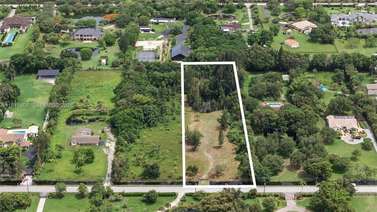 Rare opportunity of just under an acre of buildable land. Already approved by the city with a total of 2.24 acres on prestigious Mustang Trail in Southwest Ranches. This prime lot features a serene pond, lush greenery, and a peaceful, private setting—ideal for building a custom estate or high-end development. Zoned residential with a completed Phase 1 Environmental Study, it's ready for your vision. Enjoy a rural, equestrian-friendly lifestyle just minutes from Downtown Fort Lauderdale, top-rated schools, family attractions, and three international airports. Surrounded by luxury homes in a highly desirable area with limited inventory, this property offers both exceptional lifestyle appeal and strong investment potential. Build your dream home or a profitable spec estate in one of South Florida’s most sought-after communities.