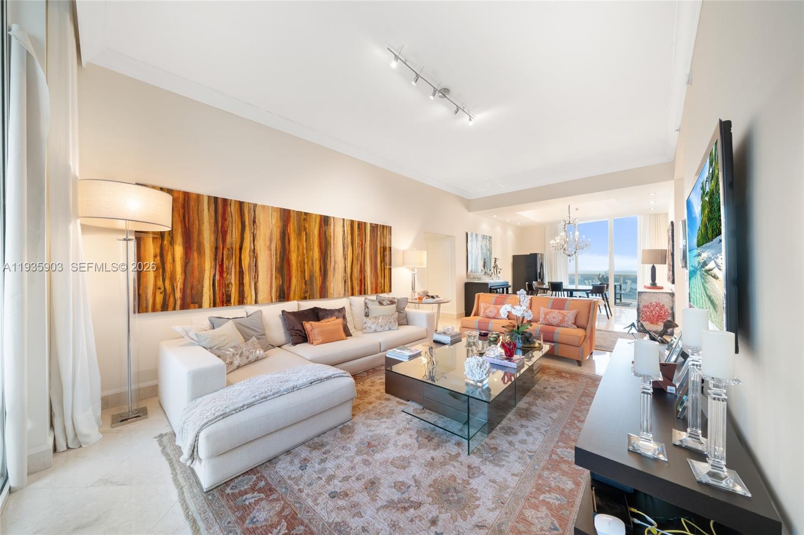 **Ocean and bay views, and 1 assigned parking** in this exceptional east–west residence, offering sunrises over the Atlantic and sunsets across the Intracoastal. This fully furnished 3 spacious bedrooms and 3.5 elegant baths is thoughtfully curated with distinctive art pieces, blending sophistication with comfort throughout. The residence offers seamless flow, refined finishes, and abundant natural light. Every room opens to its own private balcony
Near causeways, Bal Harbour and restaurants. Residents enjoy world-class amenities including a private beach club, full-service spa, state-of-the-art gym, and pool.