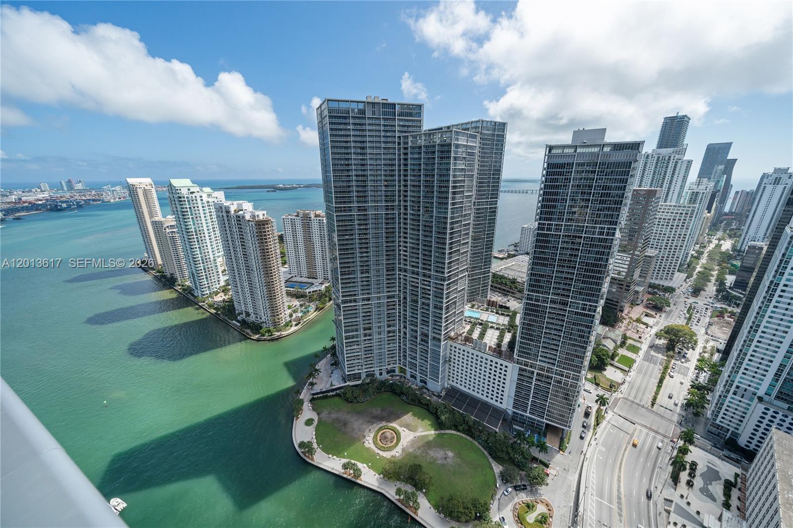 Perched high above Brickell in the iconic EPIC Residences, this exceptional 3-bedroom + den, 3.5-bath residence offers over 2,500 SF of refined interiors and a spacious private terrace with sweeping views of Biscayne Bay and the Miami River.

Floor-to-ceiling glass surrounds the expansive living and dining areas, flooding the home with natural light and showcasing the building’s signature curved façade. The open kitchen is ideal for both everyday living and entertaining, complemented by generously sized bedrooms and a versatile den perfect for a home office or media room.

Designed for both comfort and functionality, the residence features an exceptional amount of storage throughout, including numerous closets, custom-built cabinetry, and thoughtfully integrated storage spaces—an uncommon and highly valuable feature in comparable units.

The primary suite offers a spa-inspired bath and generous closet space, while all bedrooms ensure privacy and comfort.

Additionally, the price includes 2 assigned parking spots, and a storage unit.

Residents enjoy access to the luxury amenities of the Kimpton EPIC Hotel—including pools, spa, fitness center, and dining—while benefiting from a completely separate private entrance and residential lobby, ensuring privacy and exclusivity.

Ideally located steps from the best venues Miami has to offer, this is a rare opportunity to own a premier high-floor residence with iconic views.