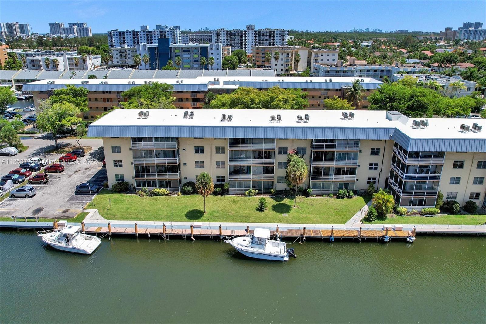 Beautiful Corner Unit located in Eden Isles in the lovely neighborhood of Eastern Shores! Unit is in perfect move in condition. Beautiful laminate floors through out. Split bedroom floor plan. Very spacious rooms with walk in closets. Eastern Shores is located in fabulous residential neighborhood with 24 hour guard house - walking distance to supermarket, stores, restaurants, beach, Oleta Park and much more. Parking spot Number 28. Extra storage on same floor. Note - One buyer must be over 55 years old.