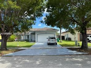 This beautiful single-family residence features 3 bedrooms and 2 bathrooms within a spacious single-story ranch-style architectural design. This quaint home feels large for it's size.   square foot lot, highlighted by a classic barrel tile roof and durable tile flooring throughout. Its standout features include a private pool perfect for enjoying the Miami climate, a two-car garage with additional driveway parking, and a prime location near Country Walk with convenient access to premier shopping, dining, and top-rated schools.  It also has a Charging station for an electric car.  Call Today.