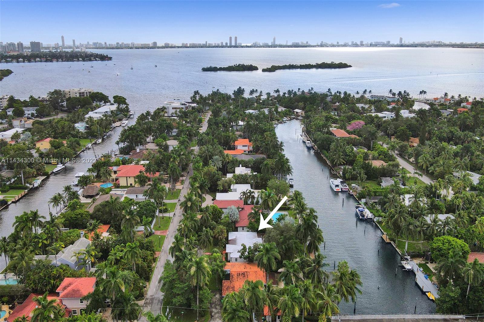 Indulge in tropical living pool home on the exclusive Belle Meade Island, w/ a 12,375 SF lot and 75FT of water frontage, you'll enjoy direct ocean access and no fixed bridges to Biscayne Bay. Wood flooring guides you through spacious living areas, 4 bedrooms & 3 baths. Outdoor pool perfect entertaining, while the 75-ft waterfront dock provides a serene spot to witness breathtaking sunsets & playful dolphins. Belle Meade Island boasts round-the-clock security & a prime location just minutes from Design District, Miami Beach, and Downtown Miami. Additionally, this property presents an excellent development opportunity, with new construction houses dotting the island. Whether you choose to reside in this exceptional home now or embrace the option to build later, the possibilities are endless.