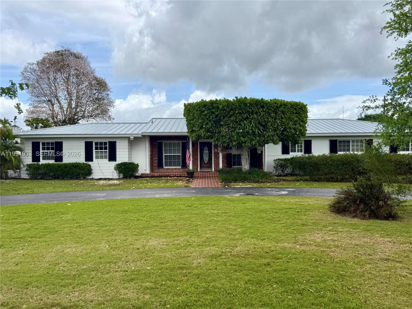 ***PRICE REDUCED!!!*** BEAUTIFULLY LOCATED HOME ON 2+ ACRES IN THE REDLAND.  4 BEDS 2 BATH WITH EXTRA ROOM ATTACHED TO SCREENED PATIO.  FULLY AIR CONDITIONED DETACHED 3 CAR GARAGE/WORKSHOP.  ATTACHED GARAGE FOR ADDITIONAL CAR AS WELL!  LARGE POOL WITH SCREEN ENCLOSURE MAKES FOR A LOVELY ENTERTAINMENT AREA. SPACE FOR A HORSE OR TWO! FULLY FENCED BACK YARD. LOVELY LANDSCAPING. NO HOA!!!