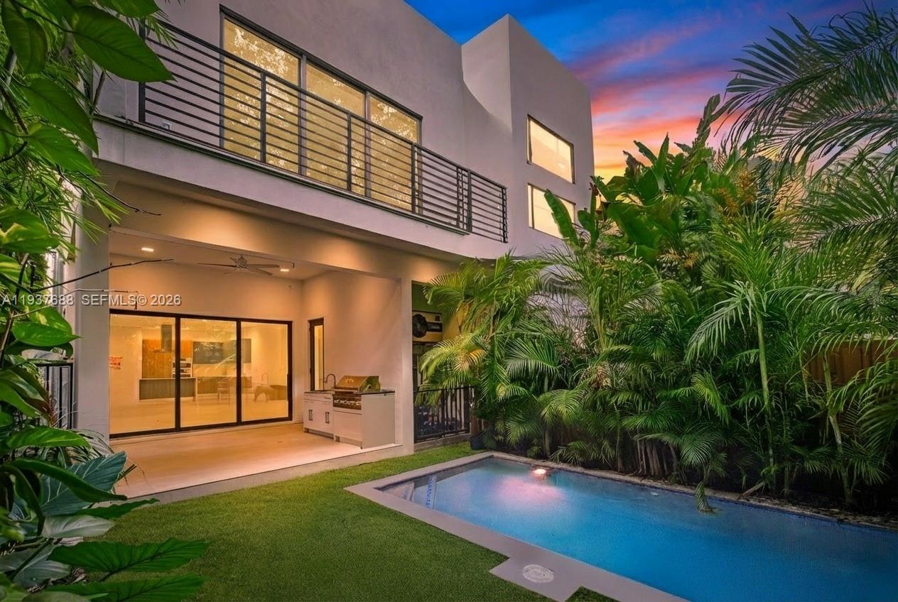 Tucked behind a private gate on a quiet Coconut Grove street, this 2022 contemporary townhome delivers architectural edge with effortless luxury tropical living. With 4 bedrooms and 5 full bathrooms, it's all about the Grove lifestyle. 

Inside, the natural light-filled open floor plan is framed by floor-to-ceiling impact glass and clean modern lines. The kitchen is the heart of this home with Italian Pedini cabinetry, Bosch stainless appliances, quartz counters, and a host-ready layout (or the perfect spot for a calm morning espresso). Smart-home features, electric blinds, dual-zone A/C, Tesla Charger in garage, and spa-inspired baths add “new construction done right” ease. 

Outside is where it really shines. Step into your private resort: a heated pool that’s unusually generous for the area, tall lush tropical landscaping for privacy, and a covered outdoor dining area complete with summer kitchen BBQ that turns weeknights into weekends. A full cabana bathroom is positioned for effortless pool-to-living convenience. Guests stay comfortable and the interior stays pristine.

Location-wise, it’s classic Coconut Grove: minutes to CocoWalk’s shops and dining, close to Dinner Key Marina, and near Peacock Park for that chill bayfront rhythm. Near parks, marinas, top schools, shopping, hospitals, and so much more!

Welcome Home! This is Luxury Coconut Grove living, natural light, and a backyard that feels like it's own unique destination. Come live the life others dream of.