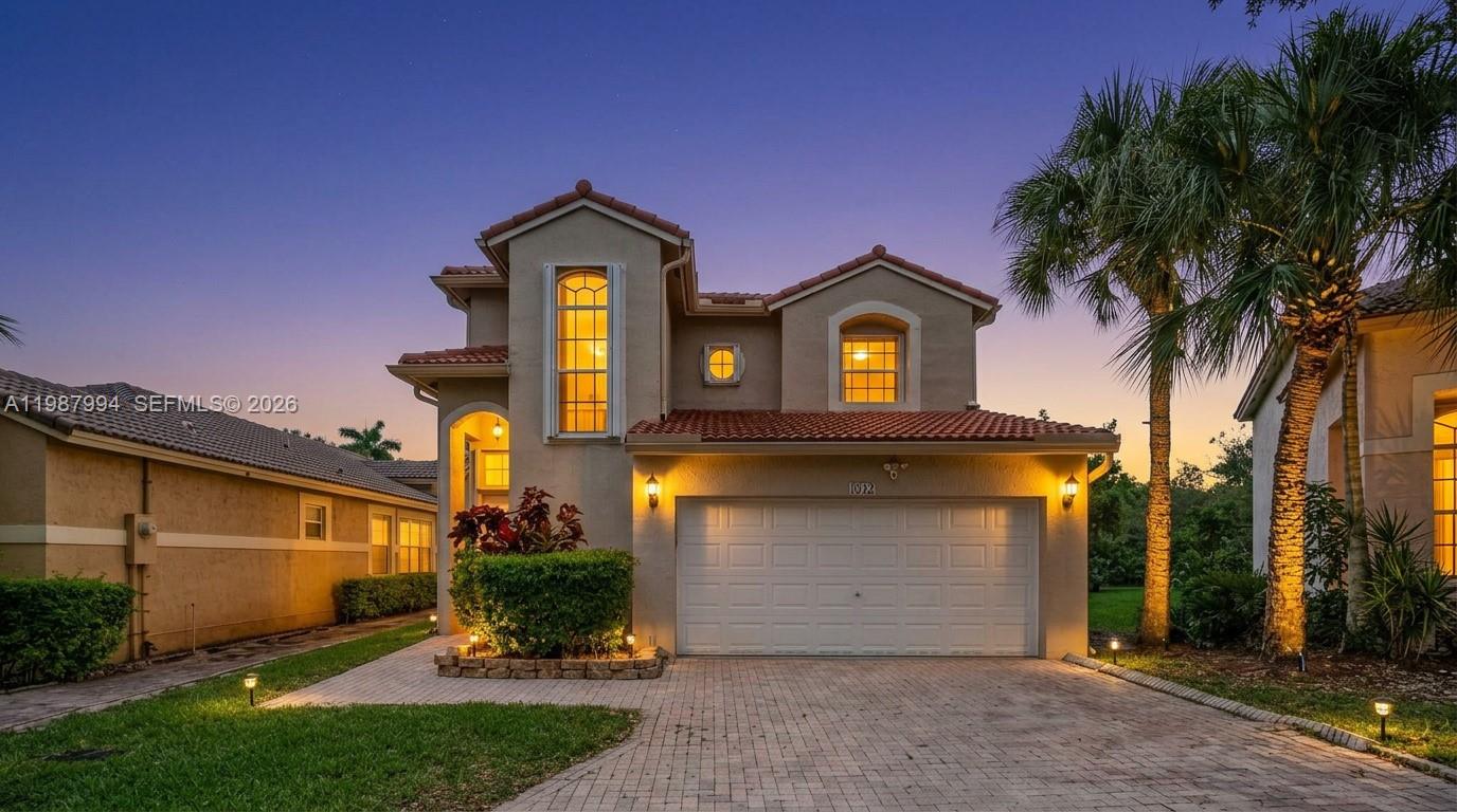 The 1st thing you will notice in this 4 beds/2.5 baths home is the GATED, GUARDED ENTRANCE, bringing you peace of mind with the controlled access. The 2nd thing you will notice is the CUL-DE-SAC, CORNER location, and GUEST PARKING RIGHT IN FRONT. The 3rd thing you will notice is the NATURAL LIGHT due to the living room's HIGH CEILING and MANY WINDOWS throughout. The different rooms connect easily, offering flexibility on furnishings and flow. The MAIN SUITE IS ON THE GROUND FLOOR, with 2 CLOSETS, and the other bedrooms are upstairs, bringing you privacy and comfort. The OVERSIZED LOT, with 11,500+ sq. ft., has your very own mango tree for that Florida, tropical feeling. Speaking of Florida living, notice the home has ACCORDION SHUTTERS for convenient storm preparation. Cleaning is also a breeze, as it does not have any carpet, but it does have a utility sink in the garage, so you don't wash rags and shoes in the kitchen. The ROOF AND THE A/C SYSTEM ARE BOTH ONLY 4 years old, but this home offers even more, such as the 2-car garage with NEW EPOXY FLOOR and automatic opener, and security cameras, too. The association has a clubhouse, a fully equipped gym and aerobics studio, locker rooms, PICKLEBALL/tennis/basketball courts, a jogging trail, 3 swimming pools, covered picnic areas and 2 children playgrounds. In addition to all these amenities, the HOA fee also includes alarm, basic cable/basic internet and landscaping. NO APPROVAL AND NO PET RESTRICTIONS! Come see it in person!