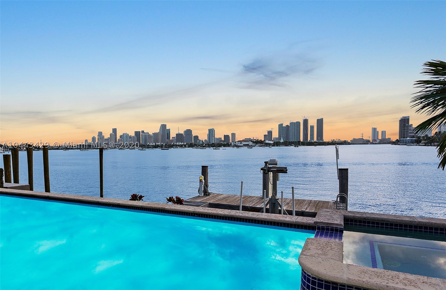Location, location, location! Live on the wide-open water with the most coveted view in all of Miami. Enjoy sweeping views of the downtown Miami skyline & the most dramatic sunsets from this new Italian style waterfront villa. Enter the home through a charming courtyard & beautiful foyer. Boasting 5 bedrooms, 5 bathrooms & 2 half baths this 6,788 square foot residence sits on a 9,953 square foot lot. Features include: boat dock/lift, 2 garages, a guest house with separate entrance, formal dining room, family room with double height ceilings, custom woodwork throughout, a gourmet kitchen with Sub-Zero & Wolf appliances, marble & wood floors, an expansive master suite with a kitchenette, his/hers walk in closets, a spa-like master bathroom & an expansive balcony offering panoramic views.