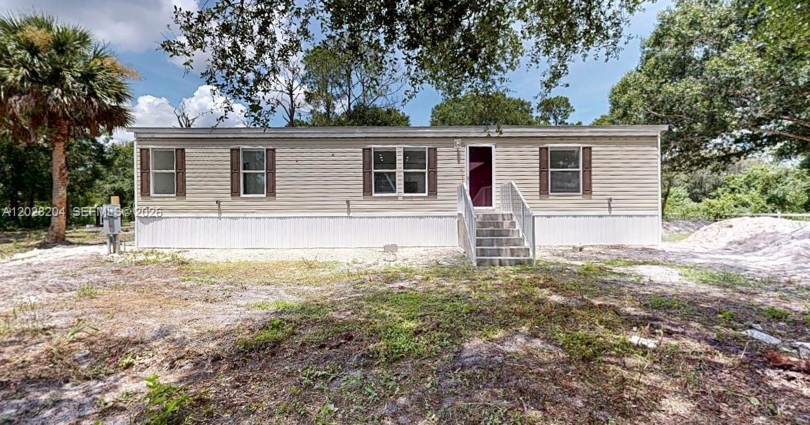 Amazing Modern Pre-Fabricated Home with high quality interior design and appliances. This includes 3 bedrooms, 2 full bathrooms, wall to wall tiles, a covered porch, and a motorized gated entrance to the property. This is not only a house, but also styled as a modern farm! Plenty of space to park Boats, Trailers, even commercial vehicles... there is plenty of space to accommodate.