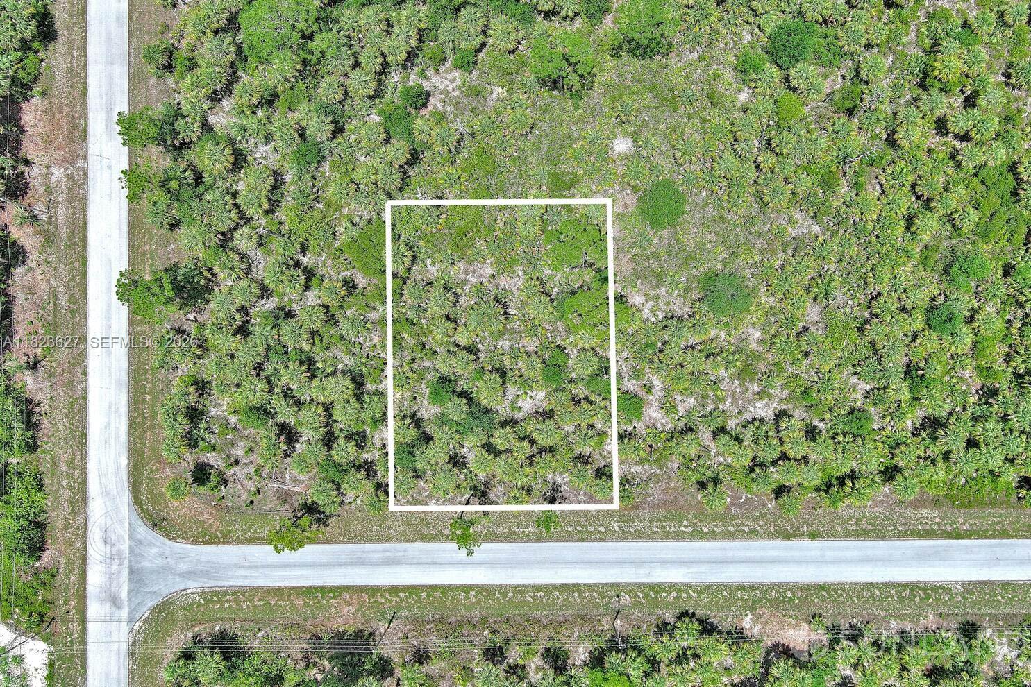 Exclusively presented by Sunland Real Estate: This is a charming and spacious property nestled in the heart of Lehigh Acres, Florida. This inviting lot offers a fantastic opportunity to build your dream home in a serene and peaceful setting, with ample room to bring your vision to life. With its desirable location, you'll enjoy the perfect balance of privacy and convenience. The property is situated in a well-established neighborhood, surrounded by a mix of modern homes and lush greenery, providing a tranquil atmosphere while still being close to essential amenities. From schools and shopping centers to dining options and recreational parks, everything you need is just a short drive away. Don't miss the chance to make this prime lot your own and experience the best of Lehigh Acres living!