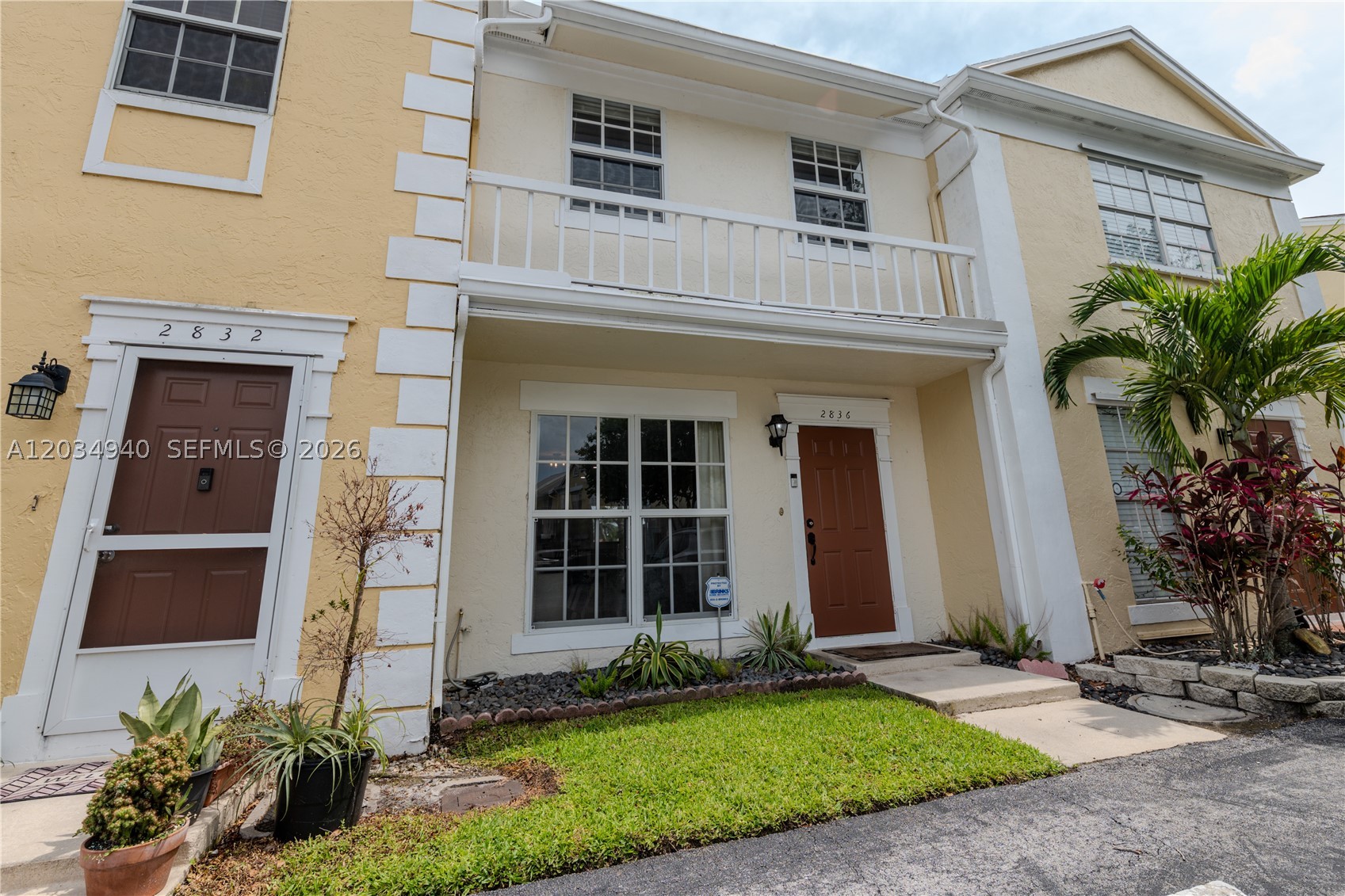 Beautiful waterfront townhome offering serene lake views and a functional open-concept floor plan. The updated kitchen features granite countertops, white cabinetry, stainless steel appliances, impact windows and a breakfast bar overlooking the main living area. Tile flooring throughout the first floor and wood flooring upstairs provide both durability and warmth.

The spacious primary suite overlooks the water and offers a relaxing retreat, while the second bedroom provides flexibility for guests, family, or a home office. Enjoy the convenience of an upstairs laundry area, ample storage, and a screened patio perfect for enjoying the lakefront setting.
Move-in ready and well-maintained, this home combines comfortable living, attractive upgrades, and picturesque water views in a desirable community setting.