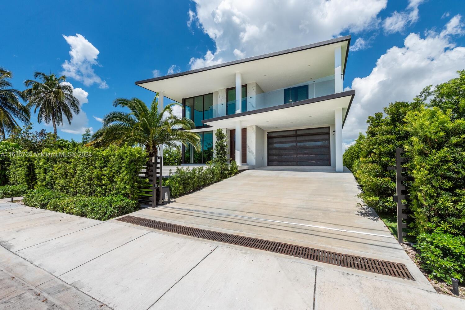 West-facing, luxury waterfront offering breathtaking sunsets and Miami's skyline views over Biscayne Bay! Built in 2022, this home features living room with soaring double height ceilings and floor-to-ceiling windows allowing natural light in, gourmet kitchen, bayfront primary suite with walk-in closets, 5 guest beds with ensuite baths. Equipped with a pool, summer kitchen, new seawall, 2-car garage, large terraces, rooftop, and dock with 60-ft frontage - this home is ideal for luxe waterfront living. North Bay Village is its own municipality, and the hottest up-and-coming area with a unique central location. A colossal, 13-acre, mixed use development by Sunbeam Properties is set to transform the area with its office and retail space, residential units, hotel space, public areas.