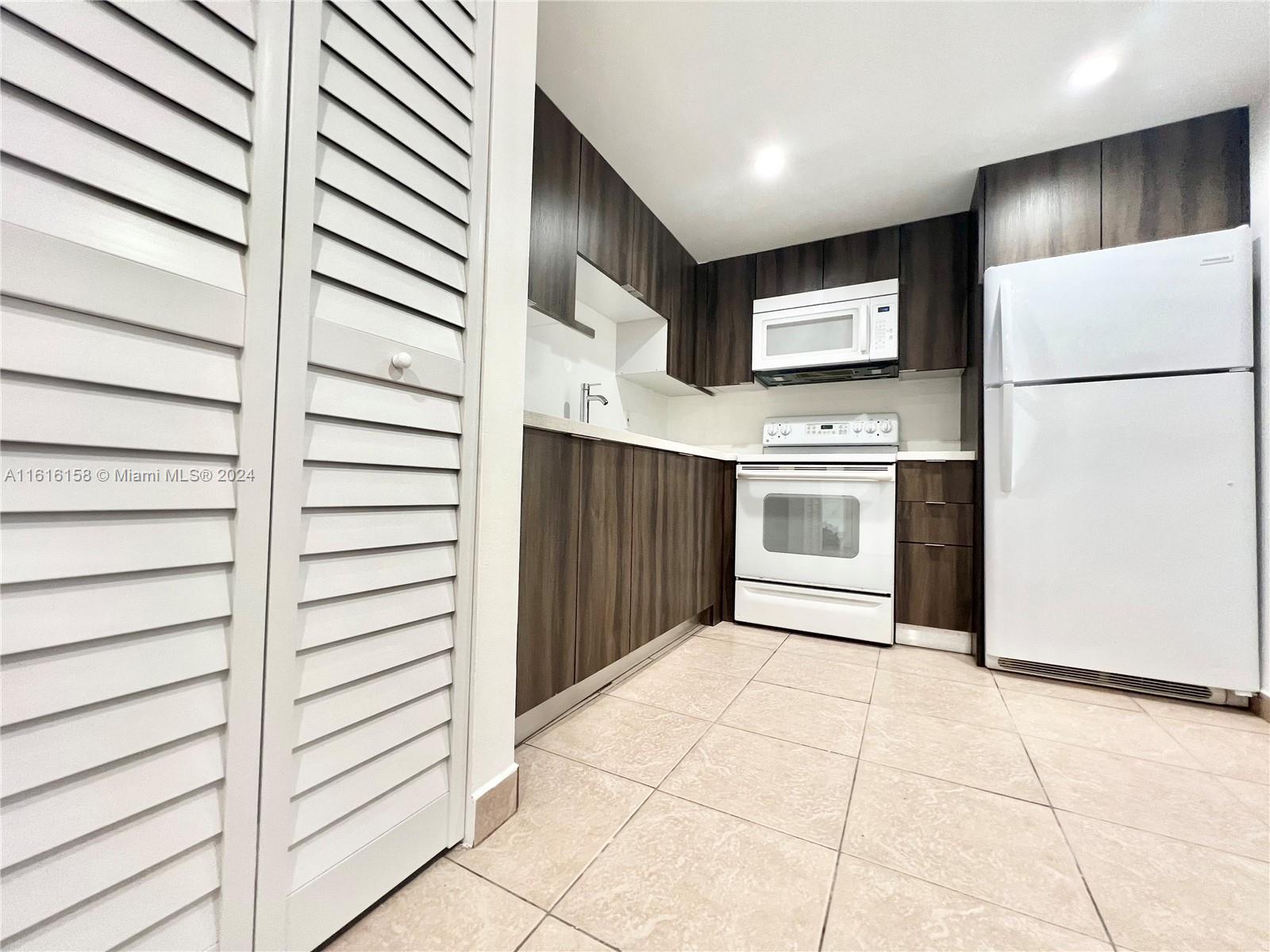 Bright and Spacious 2 Bedroom, 2 Bathroom Condo. Freshly painted and sparking clean for the new tenant. Each bedroom has its own new remodeled bathroom. Washer and dryer in unit. This unit has one assigned parking, and one additional parking will be provided by the condo association. Water is included. Parking space 401. Section 8 welcome! Close to FIU, Express Way, Restaurants, Super Market... Call me or text me for showings.