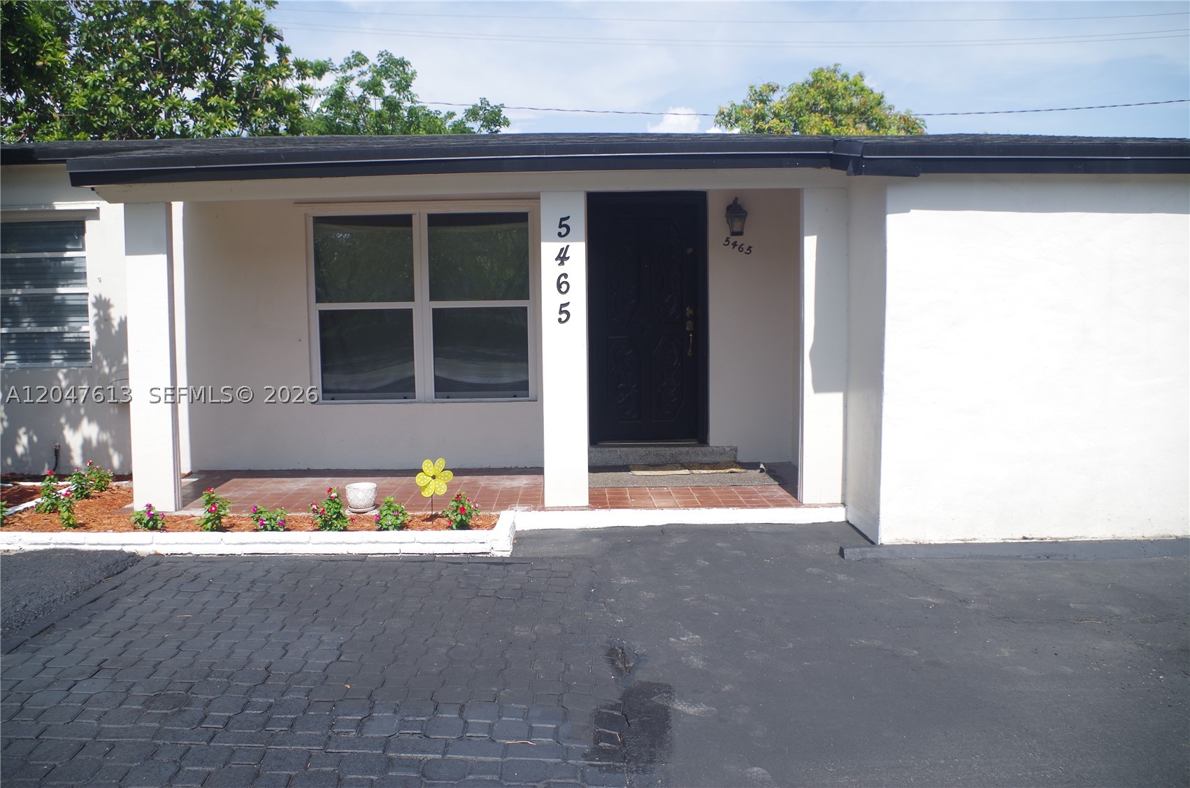 Updated and move-in ready 3 bed, 2 bath home. This beautifully renovated home offers the perfect combination of modern finishes and major system upgrades for peace of mind. Enjoy a newer roof and A/C (both within the last 2 years), updated electrical panel, and tankless water heater. Inside, you'll find luxury vinyl plank flooring throughout, a stylish kitchen featuring white shaker cabinetry, subway tile backsplash, stainless steel appliances, and abundant storage. The updated bathrooms showcase modern vanities and refreshed finishes, while spacious bedrooms provide generous closet space. Fresh neutral colors and contemporary lighting and ceiling fans create a bright, inviting atmosphere throughout. Two living areas, one is a spacious flex room with access to the backyard. Indoor washer and dryer. Outside, the home features an oversized fenced backyard with plenty of room for entertaining, pets, play, or even a future pool. Large shed for extra storage. The home is freshly painted inside and out. The paved driveway provides parking for 4 plus vehicles. No HOA means added flexibility with no monthly fees or restrictions. Conveniently located in growing Oakland Park near shopping, dining, schools, parks, and major highways, this home is ideal for first-time buyers, families, or investors looking for an updated property. Simply move in and enjoy! Easy to show.