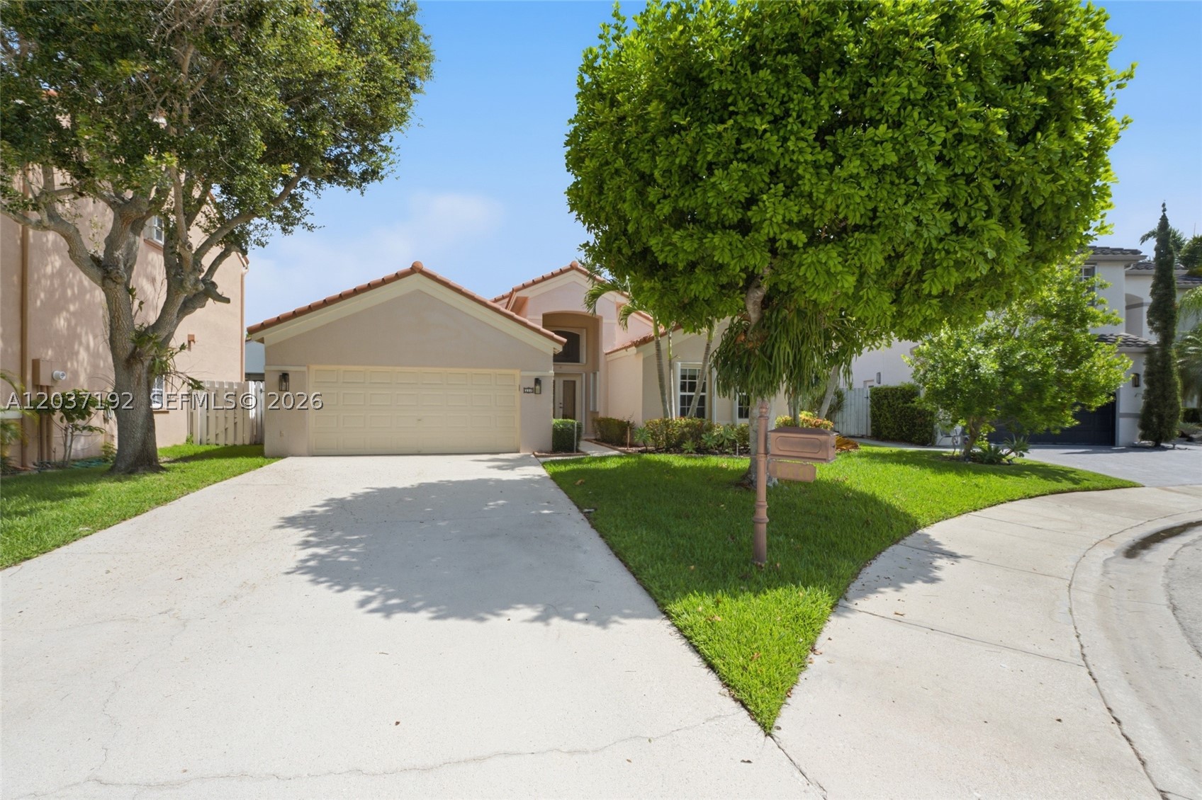 Move-in ready! Beautifully updated 4 bedrooms, 3 full baths, ONE-STORY home in one of Weston's most sought after communities - The Lakes! Tucked away behind mature trees on a quiet cul-de-sac with no through traffic on a family-friendly street that has a large passive park at the end of the block.  The spacious split-bedroom floor plan with vaulted ceilings offers formal living and dining rooms plus a comfortable family room that opens to the fully appointed kitchen featuring rich wood cabinetry and granite countertops. Enjoy seamless indoor-outdoor living with access from the primary suite and living areas to the covered and screened patio and fully fenced backyard — perfect for kids, pets, and entertaining.  2-car garage AND a rare oversized driveway with parking for approximately 7 vehicles. Newer roof 2013, New A/C 2024, Washer/Dryer 2021.  Full home protection with Impact windows (2016) + accordion shutters. Located in a guard-gated WALKABLE neighborhood w passive parks, community pool, tot-lot, picnic area, soccer/play field, great for gatherings.  Bike to A+ Weston schools incl #1 ranked elementary school in Broward! or walk to adjacent plaza for dining, ice cream/pizza, Starbucks, groceries & more. Quick access to highways, shopping & FL beaches!