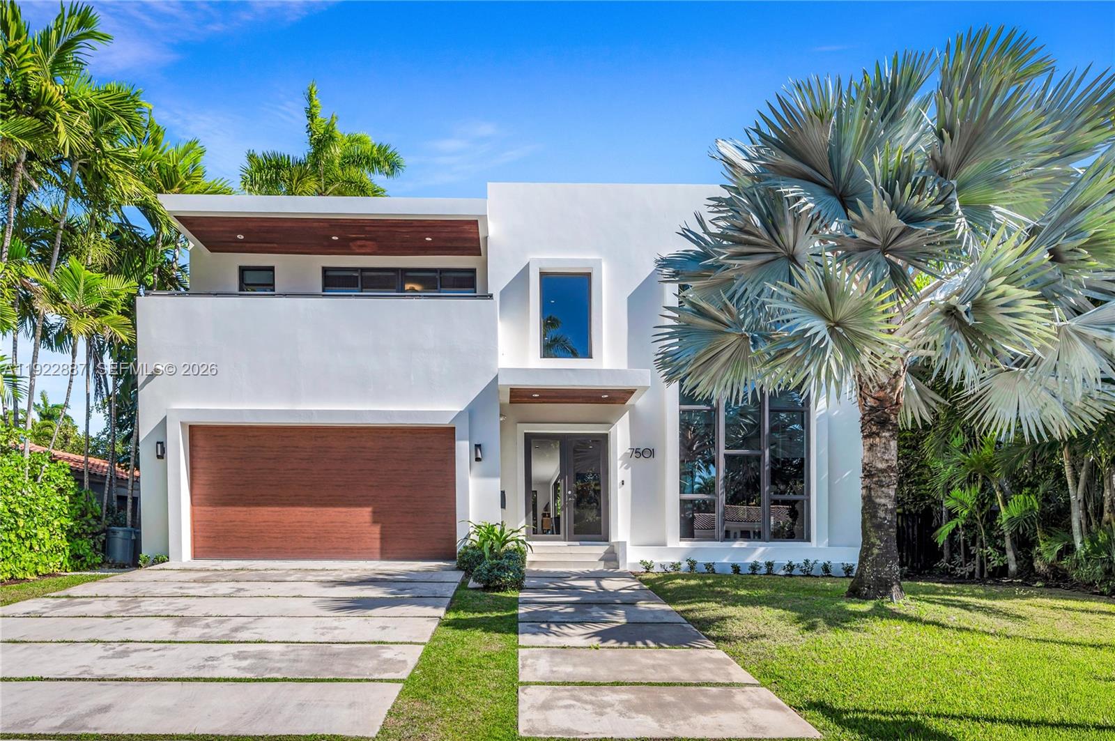 Luxury modern 5BD/5.5 BA turn-key furnished home with just under 4,700 sqft of living space plus a 2-car garage, located on the gated island of North Bay Island. This recently built two-story residence features soaring ceilings, expansive open living areas, impact windows and doors, and sleek finishes throughout. All bedrooms are en-suite with built-out closets and blackout curtains for comfort and privacy. The backyard offers a heated pool and space to entertain.

Centrally located just 20 minutes from Miami International Airport, 15 minutes from Downtown Miami, and about 12 minutes drive from the top rated private schools. Also conveniently close to Bal Harbour Shops, and the best of Miami Beach shopping and dining.