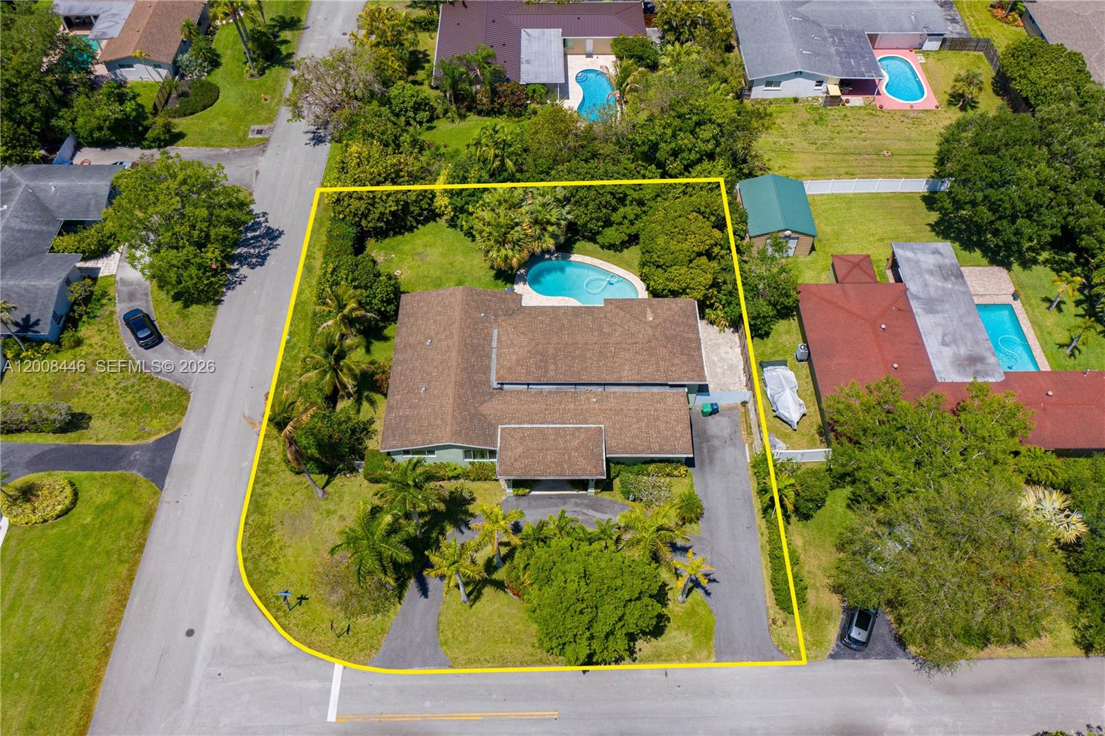 Rare opportunity in North Palmetto Bay! Situated on an oversized 17,812 sq. ft. corner lot in an X flood zone, this one-story home offers exceptional space, flexibility, and outdoor living potential rarely found at this price point. Designed with a split floor plan, the layout provides privacy and versatility, including a generously sized bedroom with an adjacent full bathroom, well-suited for guests or extended family. The bathroom features a spacious walk-in shower. The home features a large kitchen with granite countertops and an oversized island that opens to the family room, creating an ideal setting for gatherings and everyday living. The primary bedroom (approx. 14 x 15) offers comfortable proportions. The property feels larger than reflected, as it includes a permitted addition that enhances the overall living space, offering added value and flexibility. Step outside to a private backyard retreat featuring a pool with travertine pavers, expansive green space, and a variety of mature tropical fruit trees, including mango, lychee, sapodilla, starfruit, banana, and rose apple. Additional highlights include impact windows, a circular driveway, and a two-car garage. Conveniently located near Coral Reef Park, shopping, dining, and both public and private schools. Check out the virtual tour.