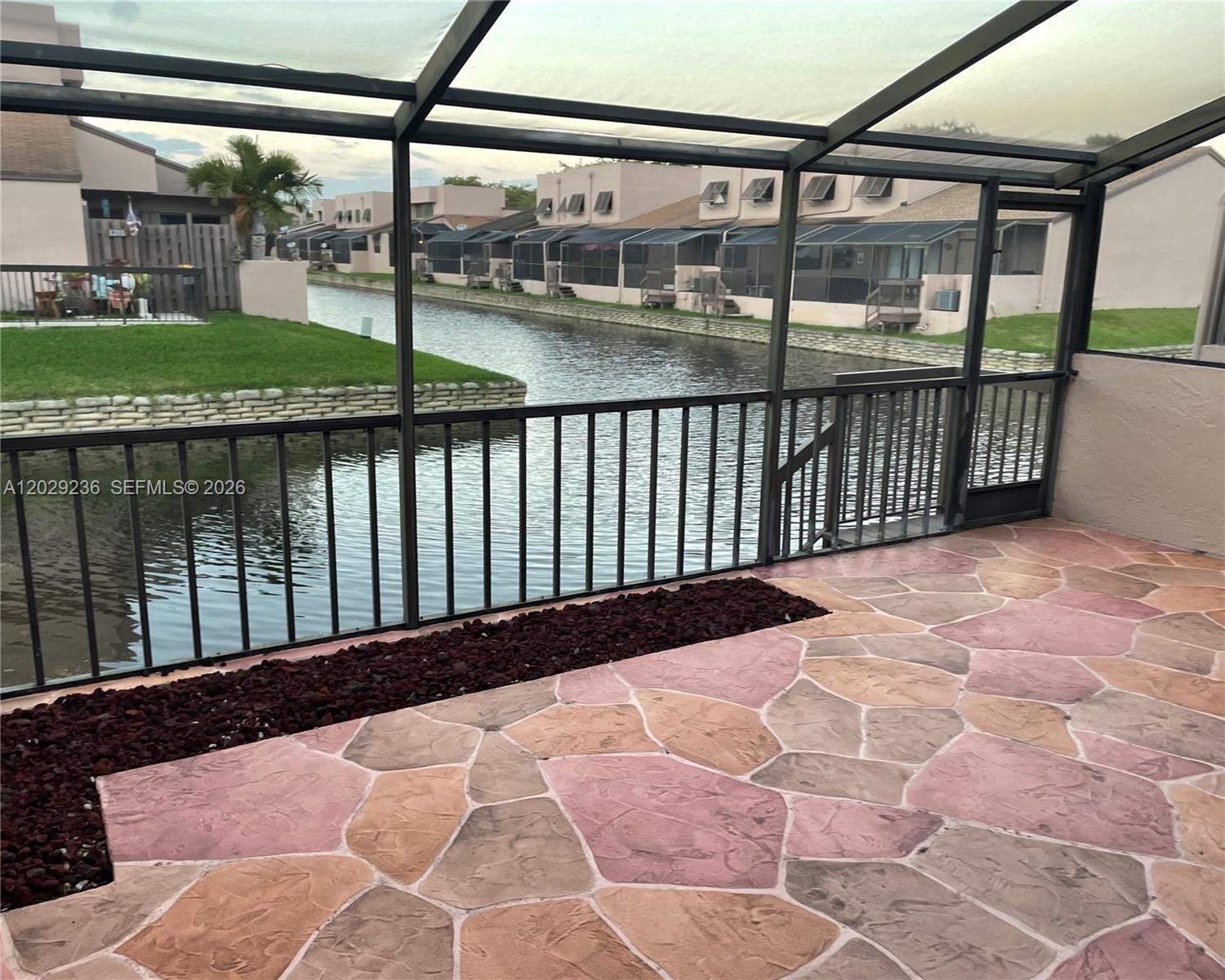 Rarely available one story townhome at Flamingo Villas in the heart of Pembroke Pines with an excellent location. Brand new kitchen, bathrooms and floors, air conditioning and a roof that is less than 3 years old. Screened back patio with beautiful water view of the canal to enjoy your breakfast in the morning. Gated community with many amenities including heated pool, tennis and pickleball courts, indoor racquetball and gym. As an added convenience the HOA has a quick approval process