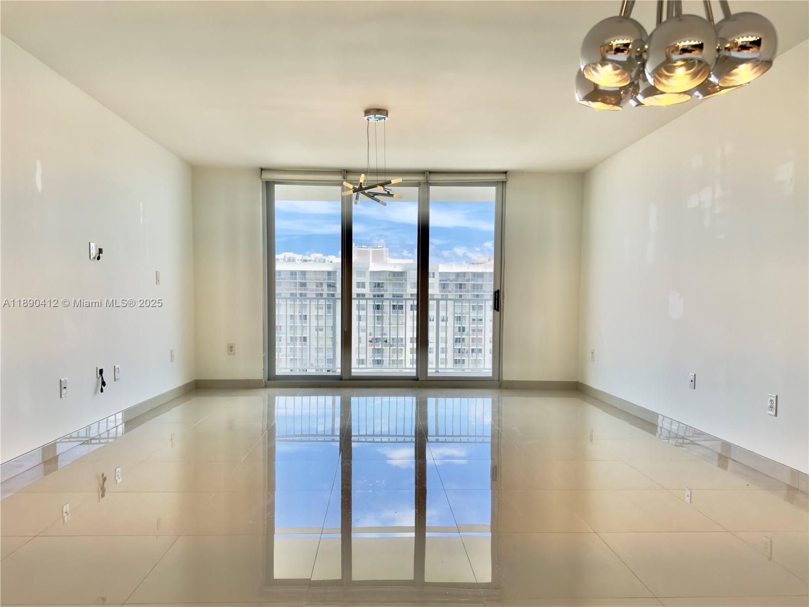 Spacious 1,000+ SqFt. Fully Renovated Residence in the Sky. Beautifully open-concept kitchen with top-of-the-line appliances and elegant quartz countertops with waterfall edges. Porcelain floors, new impact windows, and a custom walk-in closet. Rare 2 parking spaces. A true luxury building located in the heart of prestigious Aventura, the community offers 24/7 security, a staffed front desk, 2 tennis courts, 2 pools, gym, BBQ area, and much more.