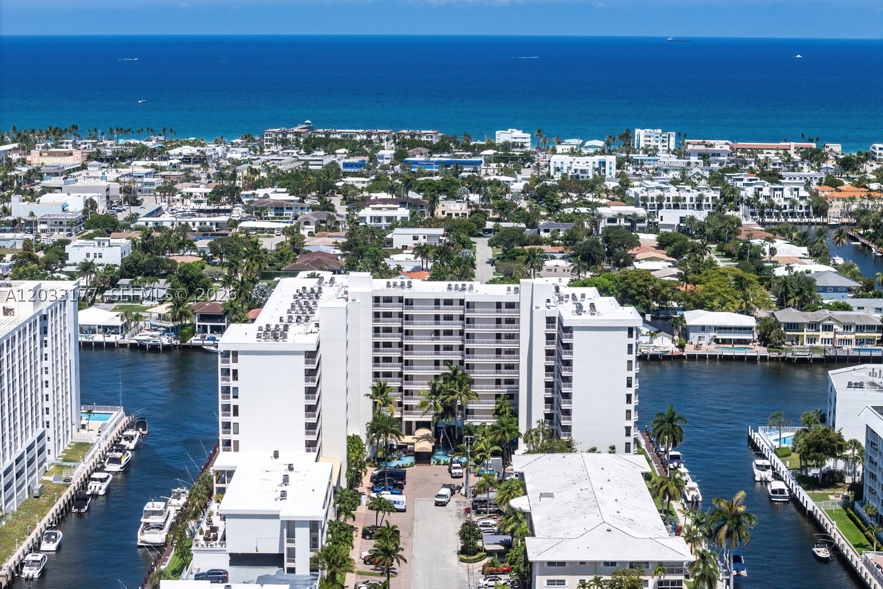 Luxury waterfront living at its finest. Dock your boat outside your apartment. Spacious 1,579 sq. ft. 2/2 apartment on the Intracoastal with amazing water views and slight ocean view. Watch the boats pass in front of your balcony. Large open space floor plan with living room, dining room and extra room. Large master bedroom with lots of closet space and view of the Intracoastal. Bathtub and walk-in shower in the master bedroom. Walk- in shower in the second bathroom. Tile floors throughout. Top brand appliances. New oversize LG washer/dryer. The Pilot House waterfront community in Coral Ridge Country Club Estates offers lobby security, fitness center, heated pool, barbeque area with outdoor dining, community lounge, pet friendly building, cable TV & WiFi, boat slip and jet ski dockage rental when available. Ideally located just minutes from Lauderdale by The Sea, the beach, shops and local restaurants. Experience resort living on the water. Available July 1, 2026.