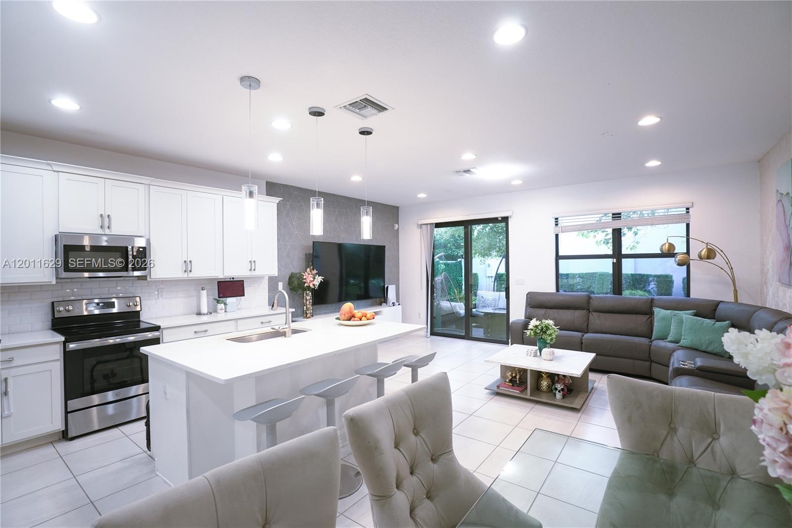 Desirable resort-style community! This beautifully maintained 3-bedroom, 2.5-bath home offers the perfect blend of comfort, style, and security within a key-card entry neighborhood. Featuring a bright and open floor plan with abundant natural light, spacious living areas, and a seamless flow ideal for both everyday living and entertaining, the home also includes a well-appointed kitchen with ample cabinetry and counter space, generously sized bedrooms, and a private primary suite designed for relaxation. Enjoy your own outdoor space perfect for unwinding or hosting guests, all within a vibrant, well-maintained community just minutes from top-rated shopping, dining, and major highways—this is Boca living at its finest!