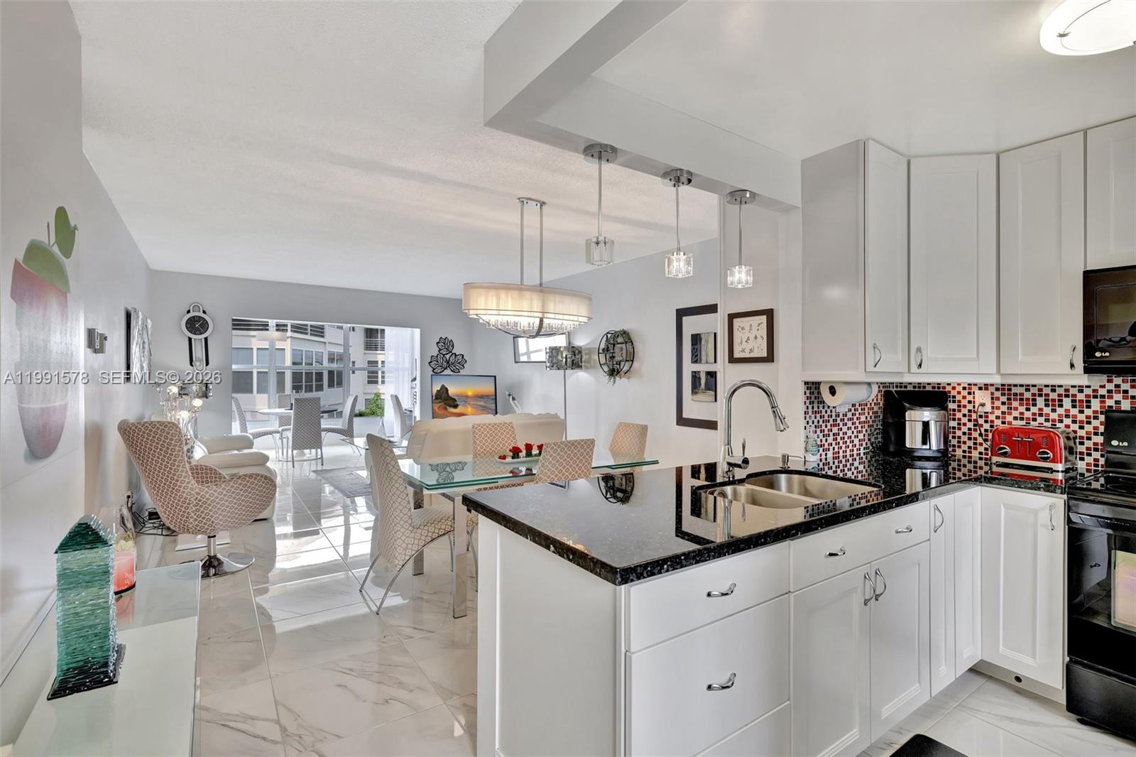 Wow, Beautiful & completely remodeled corner unit in Hawaiian Gardens Phase 7. This gorgeous 2/2 features an opened kitchen with white cabinets, granite counters, black stainless steel appliances, and a breakfast bar island, ideal for entertaining. Stunning marble-look porcelain tile floors flow throughout, and the brand-new AC and new ducts ensures year round comfort. Fully furnished with quality, turnkey furniture. Relax on your private patio with partial garden and tranquil lake views. This HOPA-verified community offers excellent amenities including shuffleboard, bocce ball, a pool, BBQ areas, billiard tables, and a gym. Experience luxury and leisure in this vibrant, active community! New roof just installed in March 2026, new AC, New Duct Work with 10 years Warranty and new Water Heater! Building has reserve and recertification is done! Wow